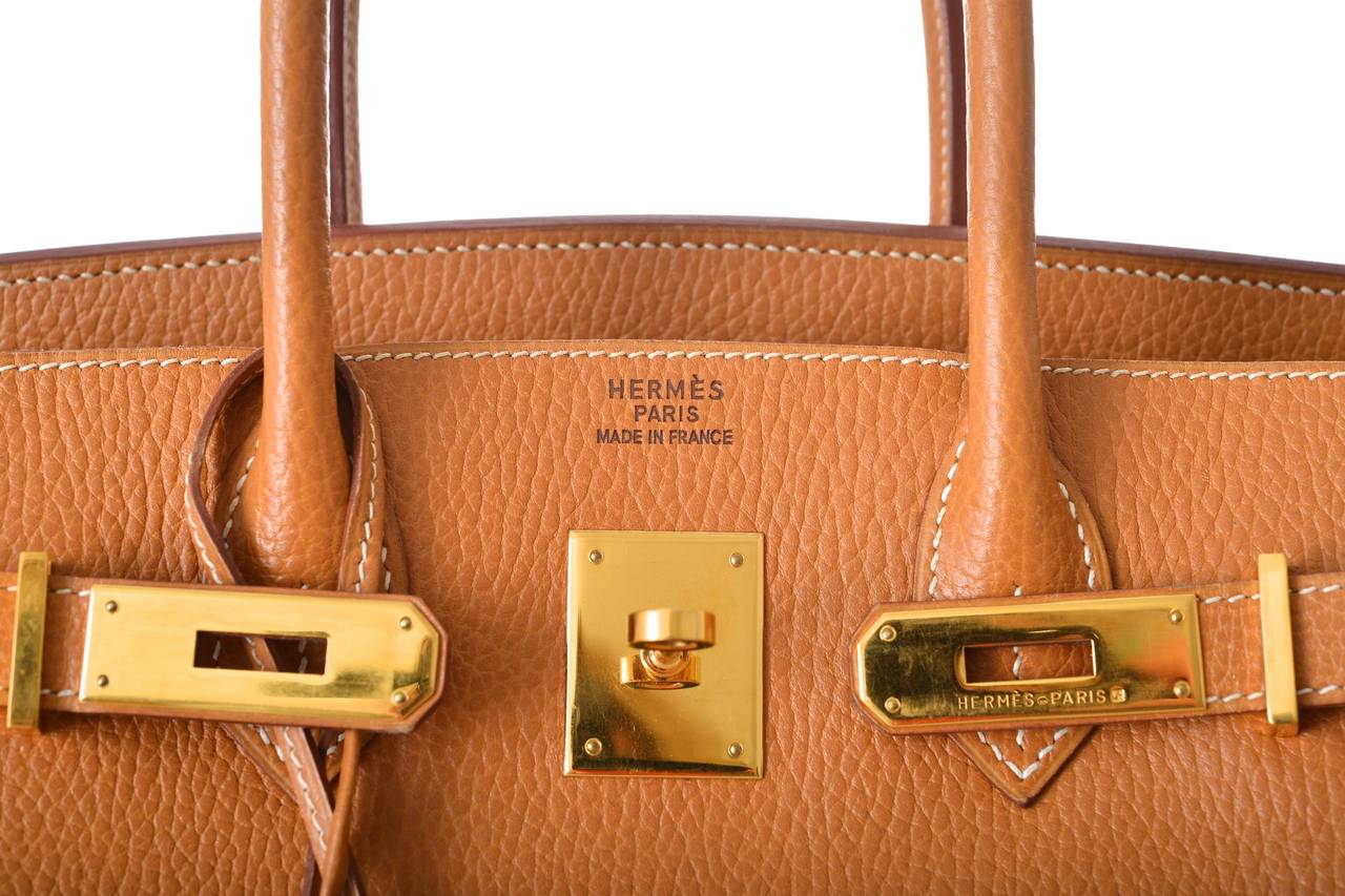 As always, another one of my fab finds! Hermes 30cm BIRKIN BAG in beautiful NATURAL GOLD WITH GOLD hardware.
SUPER RARE ARDENNE leather is now discontinued. Ardenne leather is large grain, flat, structured leather (it doesn't slouch or flop). It is