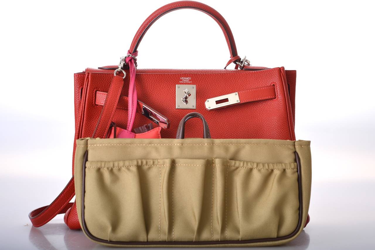 As always, another one of my fab finds!
Hermes 32cm KELLY  gorgeous bright VERMILLION with PINK CONTRAST STITCHING & PALLADIUM hardware. The leather is togo.
MY CAMERA TAKES ACCURATE PICTURES, BUT THE COLOR IS REALLY TRULY SOMETHING