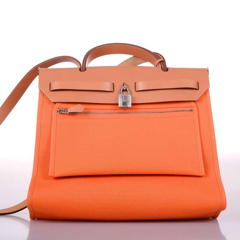 AS ALWAYS, ANOTHER ONE OF MY FAB FINDS!

HERMES NEW HERBAG WITH A GREAT NEW ZIP POCKET IN THE BAG AND ANOTHER ATTACHED LARGE WALLET INSIDE! 

31CM CLASSIC ORANGE PERFECT CROSS BODY WEAR! AN AMAZING SUMMER PIECE. LOVE IT OVER WHITE LININE