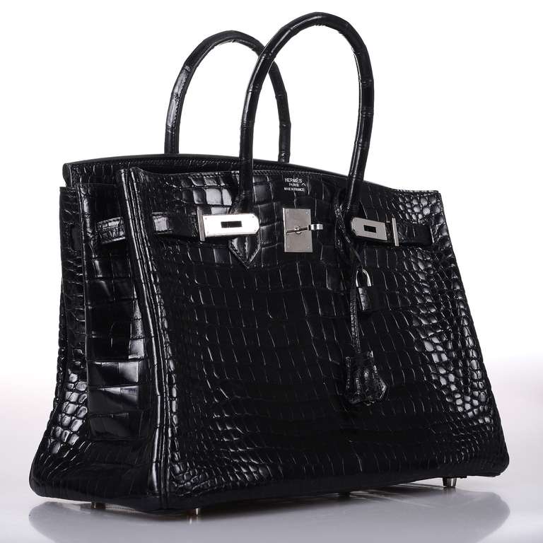 As always, another one of my fab finds! Hermes 35cm BLACK POROSUS CROCODILE BIRKIN BAG!
THIS BAG WILL TAKE YOUR BREATH AWAY! TRULY A MASTER PIECE!

This bag comes with lock, keys, clochette, a sleeper for the bag, rain protector, and box.
The