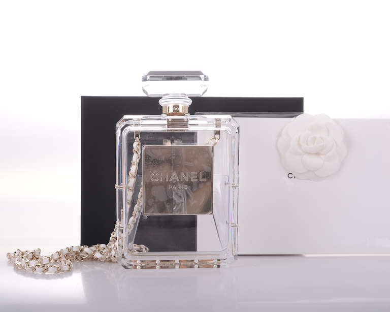 LIMITED EDITION CHANEL PERFUME BOTTLE BAG PLEXIGLASS. THIS BAG WAS ONLY OFFERED to VIP CLIENTELE.

SEEN ON FABULOUS MIRA DUMA. GORGEOUS! COMES COMPLETE WITH BOX, DUST BAG, AND AUTHENTICITY CARD. CAN BE CARRIED AS A CLUTCH OR A CROSS