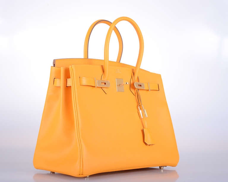 As always, another one of my fab finds! Hermes 35cm NEW HAPPIEST COLLECTION EVER!  JAUNE D'ORE BIRKIN EPSOM LEATHER WITH PERMABRASS HARDWARE!
THIS BAG WILL TAKE YOUR BREATH AWAY! TRULY A MASTER PIECE!

This bag comes with lock, keys, clochette, a