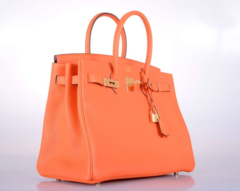 As always, another one of my fab finds! NEW INCREDIBLE Hermes BIRKIN BAG 35cm FEU (FIRE) ORANGE WITH GOLD Hardware in beautiful togo leather.

This bag is brand new with original box and accessories. T STAMP.

**Note: Accessories used for