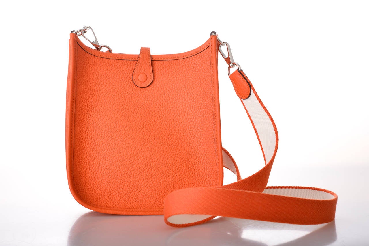 As always, another one of my fab finds! Hermes EVELYNE MINI IN GORGEOUS ORANGE.  Perfect cross body bag! Fits all the essentials phone, wallet, lipstick, and credit card. THE LEATHER IS CLEMENCE. LOVE THE REMOVABLE CROSS BODY STRAP. 
              