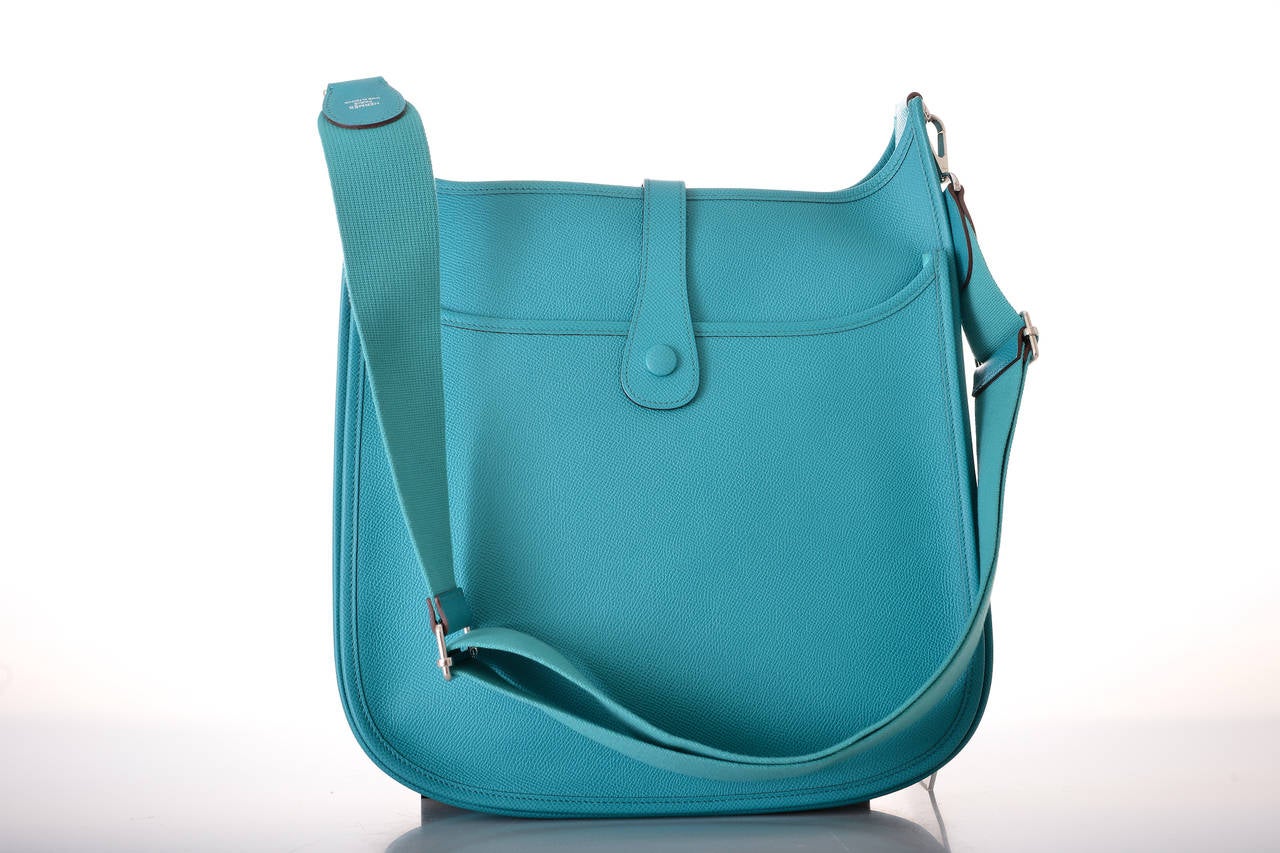 As always, another one of my fab finds! Hermes EVELYN IN GORGEOUS, ALWAYS SOLD OUT GM SIZE BLUE PAON! STUNNING COLOR. THE LEATHER IS EPSOM. LOVE THE ADJUSTABLE STRAP AND THE WAY THE BAG MOLDS TO YOUR BODY WHEN YOU CARRY IT. 
This bag comes with an