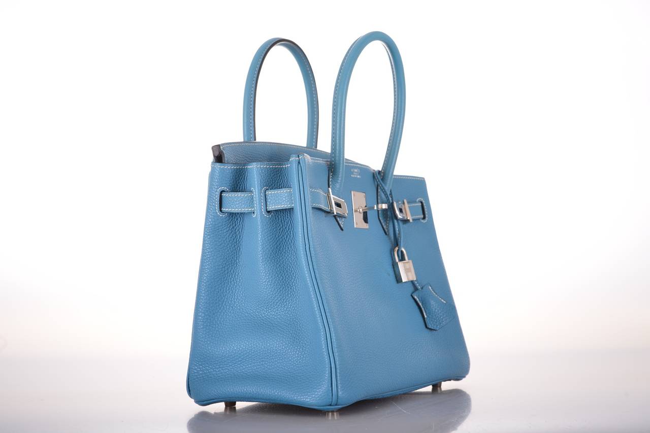 As always, another one of my fab finds! Hermes 30cm BLUE JEAN BIRKIN TOGO LEATHER WITH PALLADIUM HARDWARE!
THIS BAG WILL TAKE YOUR BREATH AWAY! TRULY A MASTER PIECE!

This bag comes with lock, keys, clochette, and a sleeper for the bag.
The bag