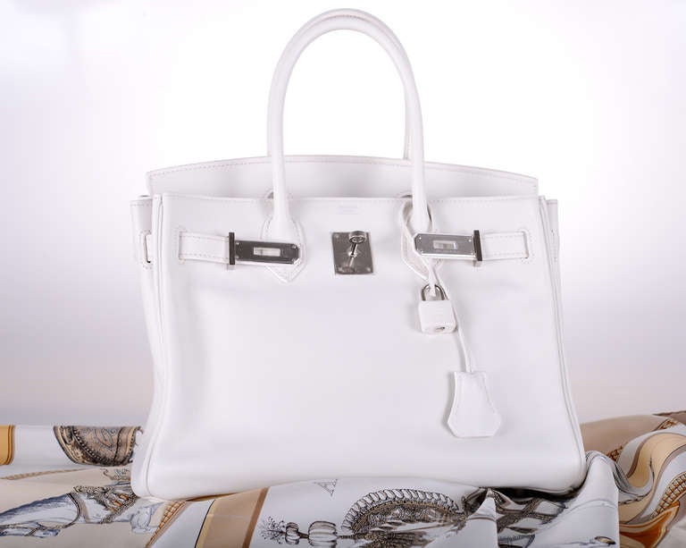 As always, another one of my fab finds! Hermes 30cm Birkin Bag in beautiful WHITE Palladium hardware SWIFT leather gorgeous!

The plastic is off the hardware (MIDDLE SPINDLE HAS PLASTIC), used a few times. The bag is absolutely in mint