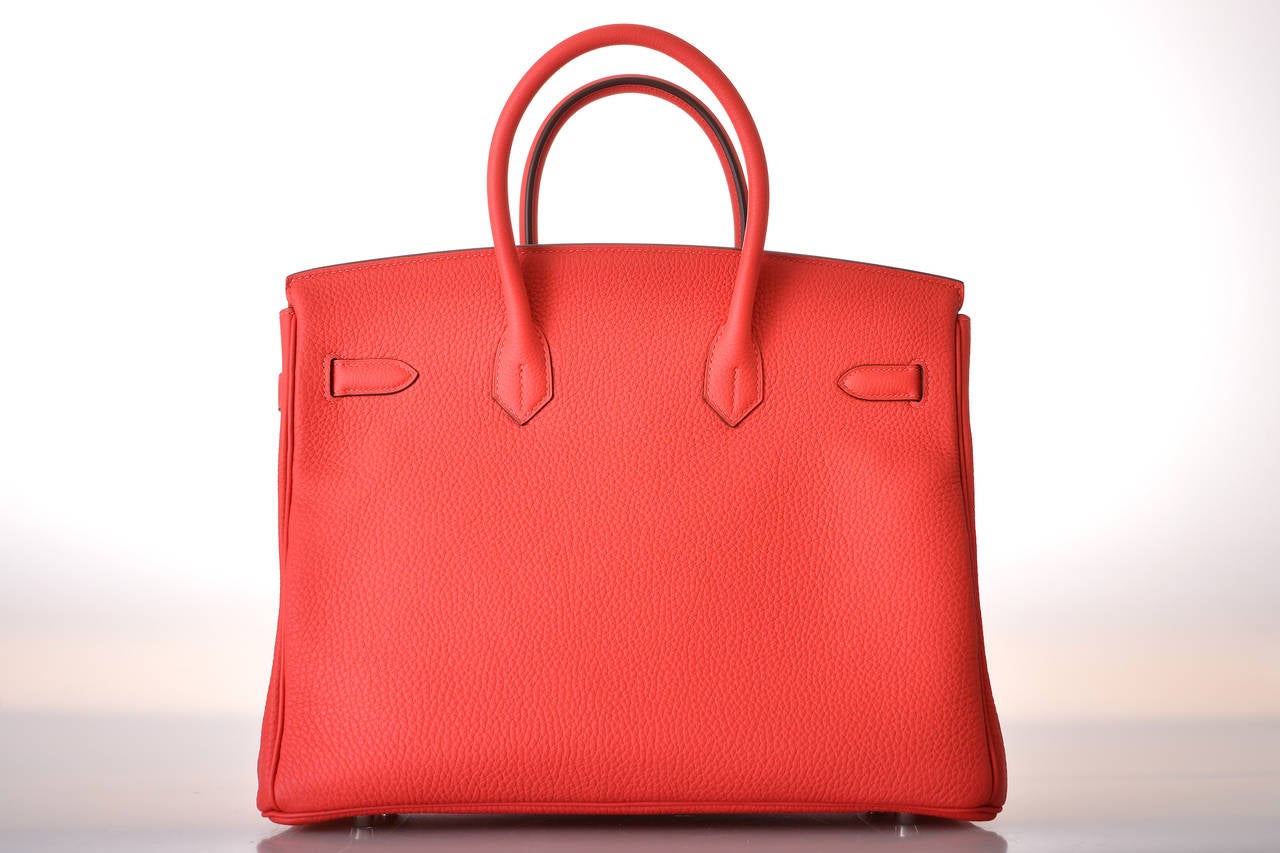 As always, another one of my fab finds! Hermes 35cm Birkin in beautiful BRIGHT ROUGE PIVOINE with palladium hardware  hardware.

This bag comes with lock, keys, clochette, a sleeper for the bag, rain protector, box, and ribbon.
The bag is Brand