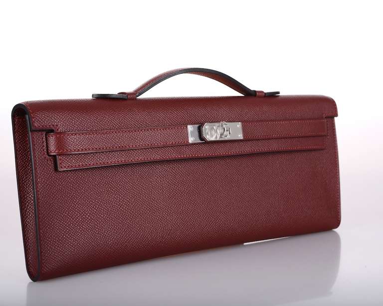 As always, another one of my fab finds! CAN'T GET THIS! Hermes KELLY CUT IN THE MOST SOPHISTICATED ROUGE H RED EPSOM! 
THE MOST GORGEOUS RED EVER with PALLADIUM hardware!

MEASURES:
12 1/4 x 5