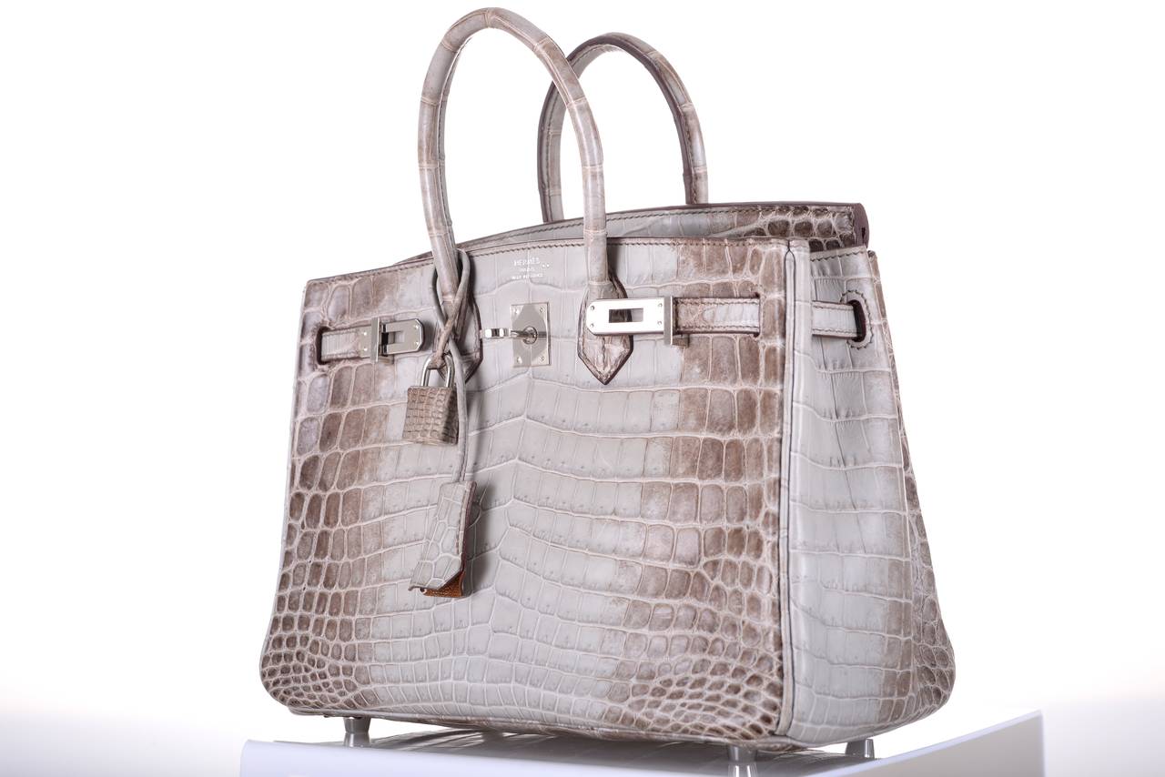 AS ALWAYS, ANOTHER ONE OF MY INSANE HERMES FINDS! 

Not your ordinary croc BIRKIN, this is very special and only offered to “elite” clientele. Grey 
himalayen.

Collector's dream and an investment for life.

Additional pictures will be