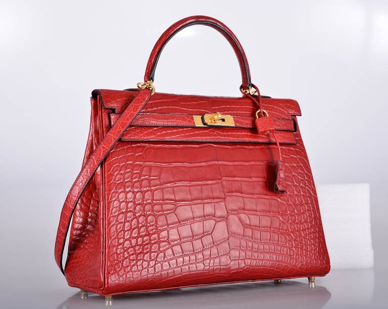 HERMES KELLY 35CM ROUGE H INSANITY MATTE ALLIGATOR CROCODILE

As always, another one of my fab finds! Hermes Kelly 35cm. The color is STUNNING ROUGE H! Perfection as always with GOLD hardware.
THIS BEAUTY IS BRAND NEW! JUST