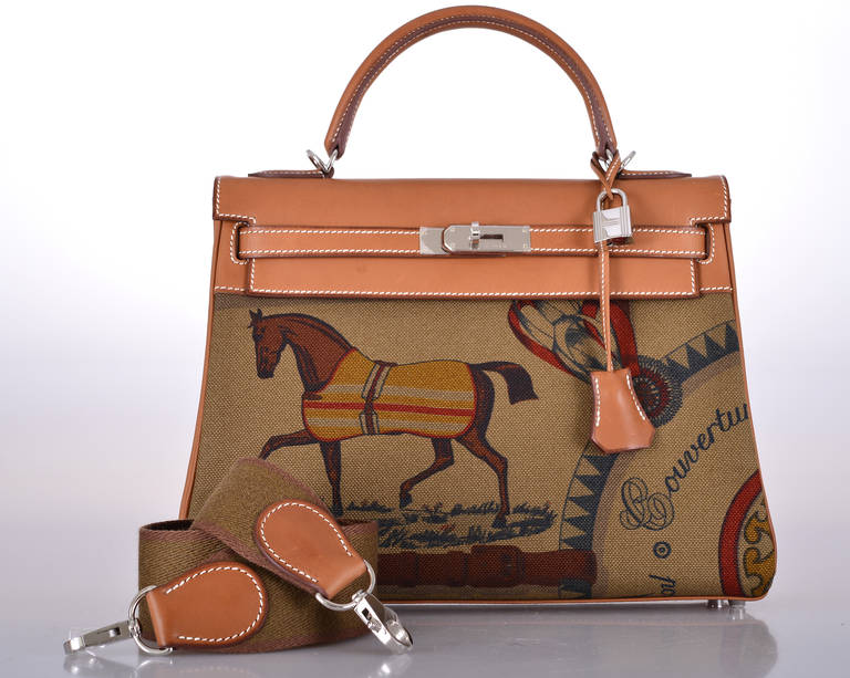 As always, another one of my fab finds! Hermes 32cm AMAZONE KELLY WITH AN AMAZING THICK SHOULDER STRAP. Palladium hardware.
SPECIAL EDITION FAUVE BARENIA WITH GORGEOUS TOILE HORSE PRINT.

This bag is brand new with original box and accessories.