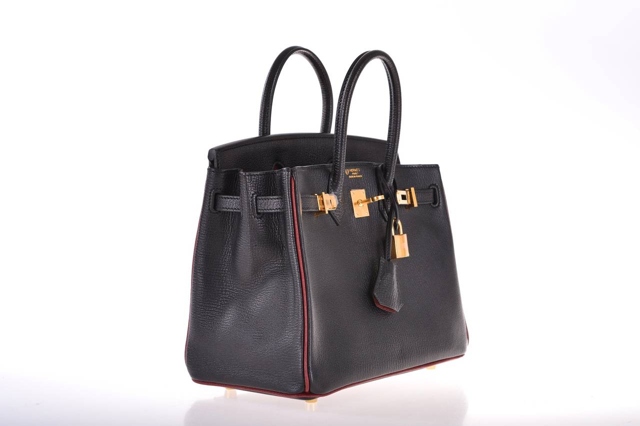AS ALWAYS, ANOTHER ONE OF MY INCREDIBLE FINDS. THIS IS A VERY SPECIAL BAG.

GORGEOUS 25cm BLACK CHEVRE (GOAT SKIN) LEATHER BIRKIN BAG WITH ROUGE H PIPNG AND INTERIOR. GOLD HARDWARE WITH CHEVRE INTERIOR. 

THE BAG IS PRISTINE WITH PLASTIC STILL