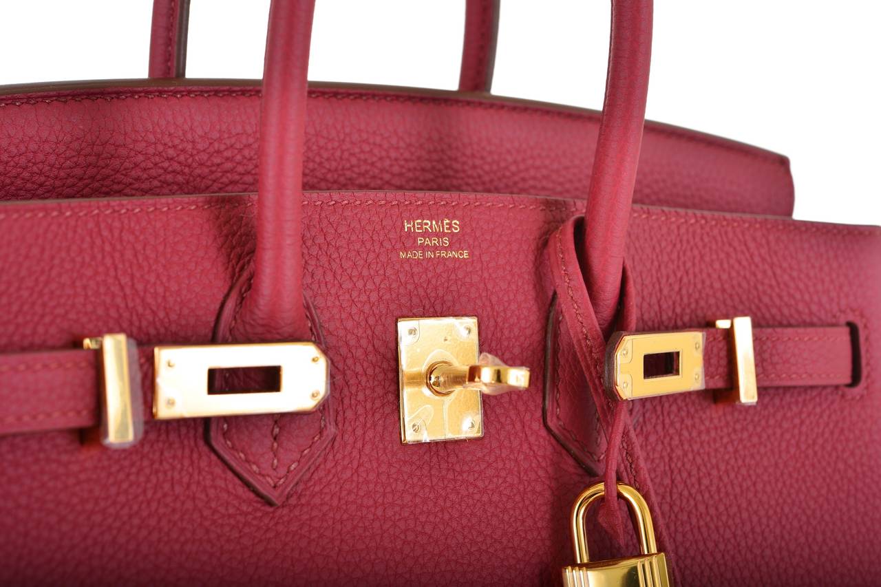 As always, another one of my fab finds! Hermes 25cm Birkin in beautiful RUBIS gorgeous rich raspberry red with GOLD hardware! Firm Togo leather.

This bag comes with lock, keys, a sleeper for the bag, and box!
The bag is brand new.

**Note: