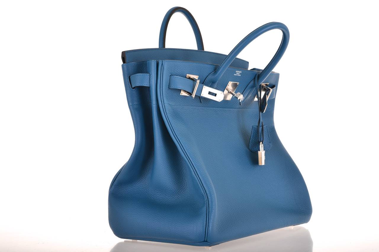 As always, another one of my fab finds! Essential luxury Hermes VERY SPECIAL HAUT A COURROIES HAC 40CM in beautiful BLEU DE GALICE  with palladium hardware.

This bag is brand new! Was used in a photo shoot. Absolutely new with all the plastic on
