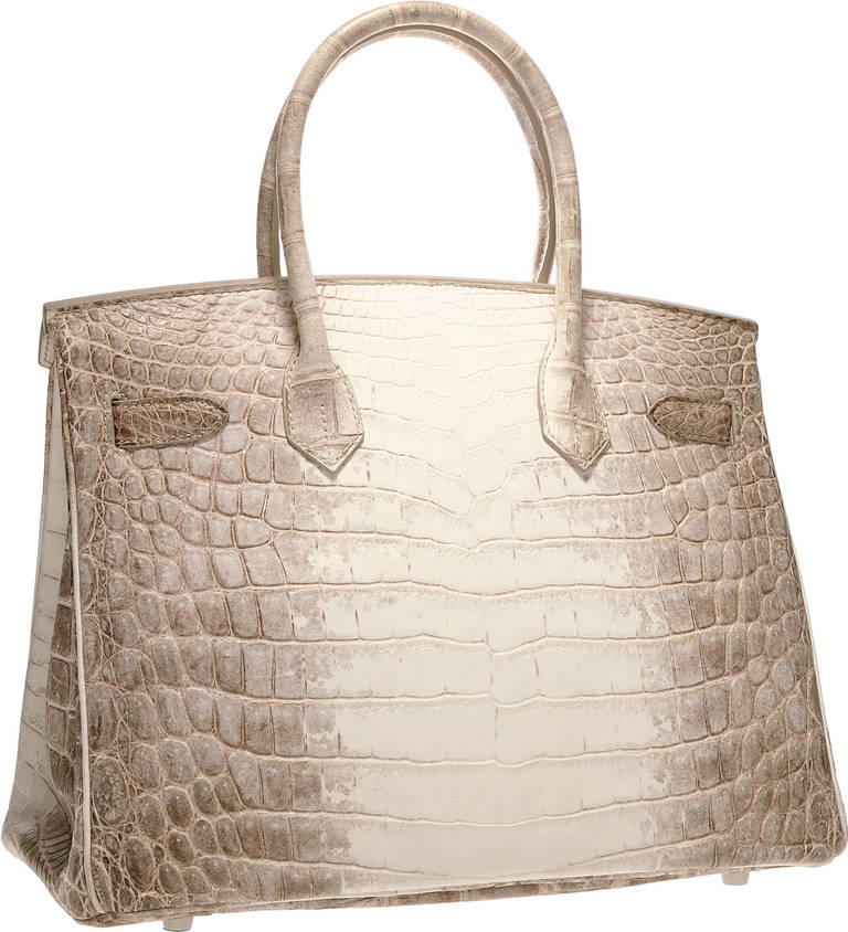 EXTRAORDINARY 30cm Diamond , Matte Himalayan Nilo Crocodile Birkin Bag with 18k gold hardware.

The rarest, most desirable and stunning handbag in the world. This bag features a subtle coloration, done in Niloticus crocodile, that is meant to