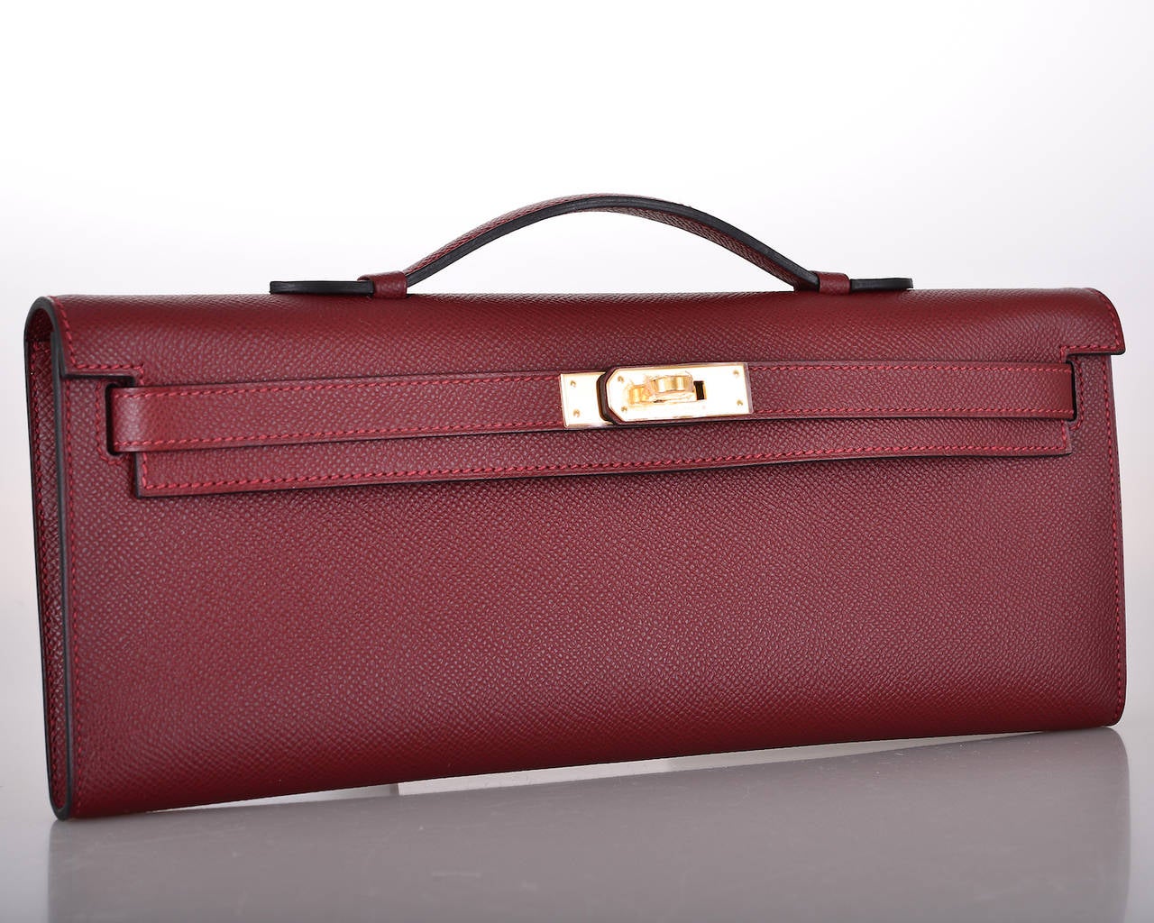As always, another one of my fab finds! CAN'T GET THIS! Hermes KELLY CUT IN THE MOST SOPHISTICATED ROUGE H RED EPSOM.

THE MOST GORGEOUS RED EVER with GOLD hardware.
MEASURES:
12 1/4 x 5
