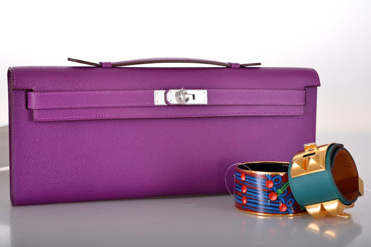 As always, another one of my fab finds! CAN'T GET THIS! Hermes KELLY CUT IN STUNNING NEW COLOR ANEMONE IN EPSOM LEATHER.
THE MOST GORGEOUS VIOLET with PALLADIUM hardware.
MEASURES:
12 1/4 x 5