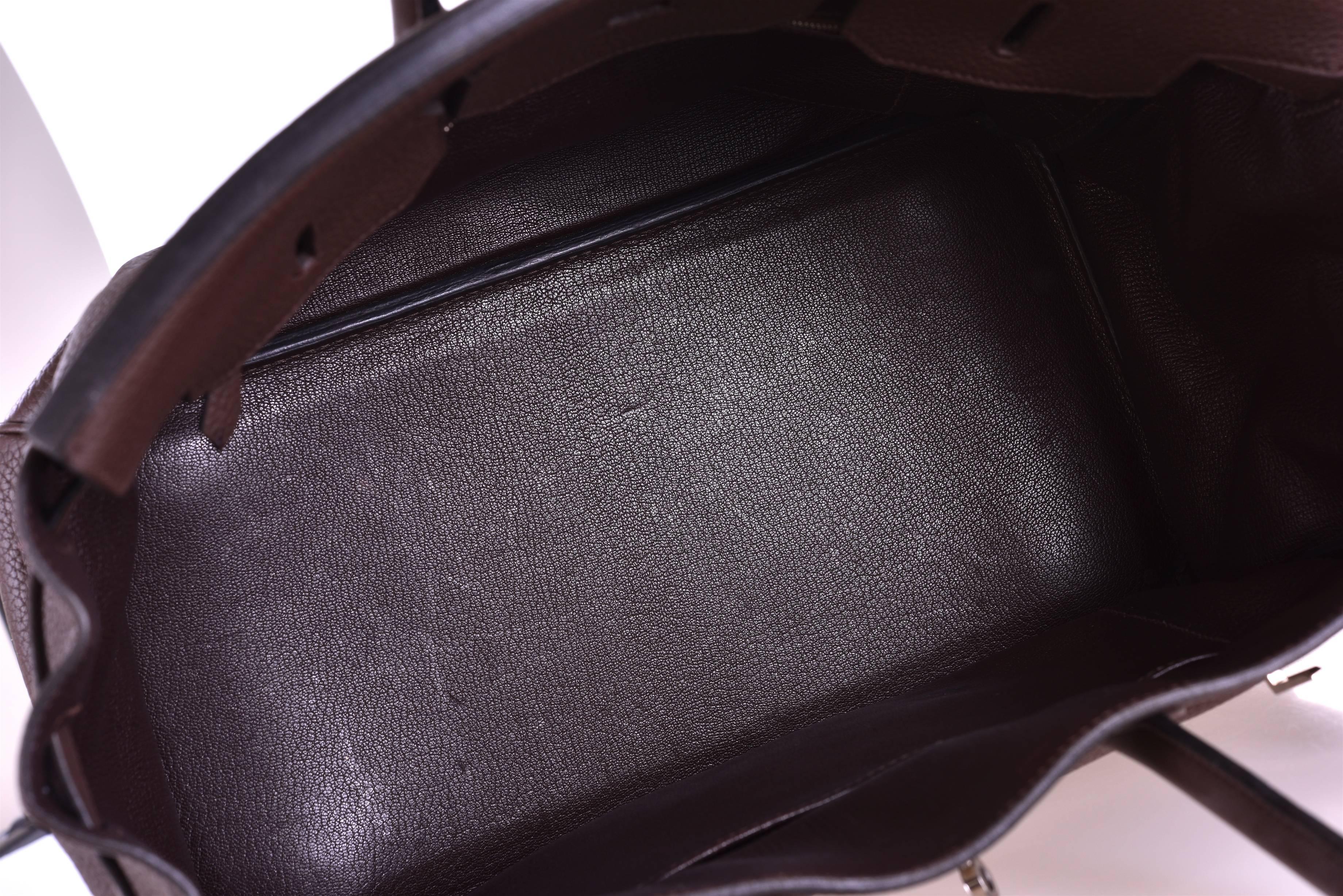 Hardware: palladium 
Country of Origin: France
Color: ebene 
Accompanied by: Care Booklet, Dust Bag, Plastic Raincoat.
Closure: Clasp
Height (in inches): 9
Width (in inches): 14
Depth (in inches): 7
Primary Material: clemence leather

This