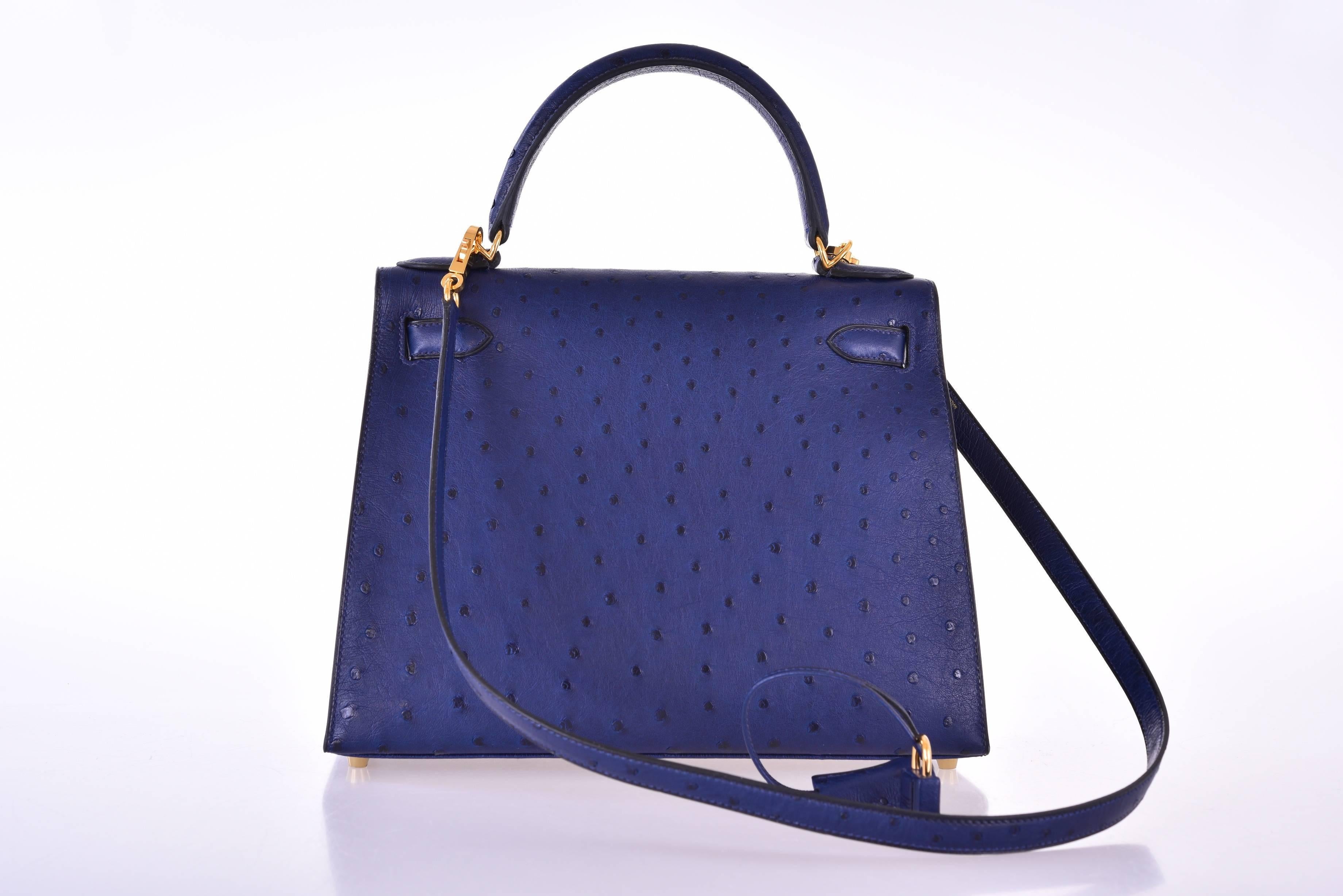 Hermes very special Blue Iris Kelly 28cm with stunning gold hardware. 

New condition 
11" Width x 8" Height x 4” Depth

The color is rich and beautiful blue navy the gold hardware makes the bag pop! 
Interior is ostrich with one zip