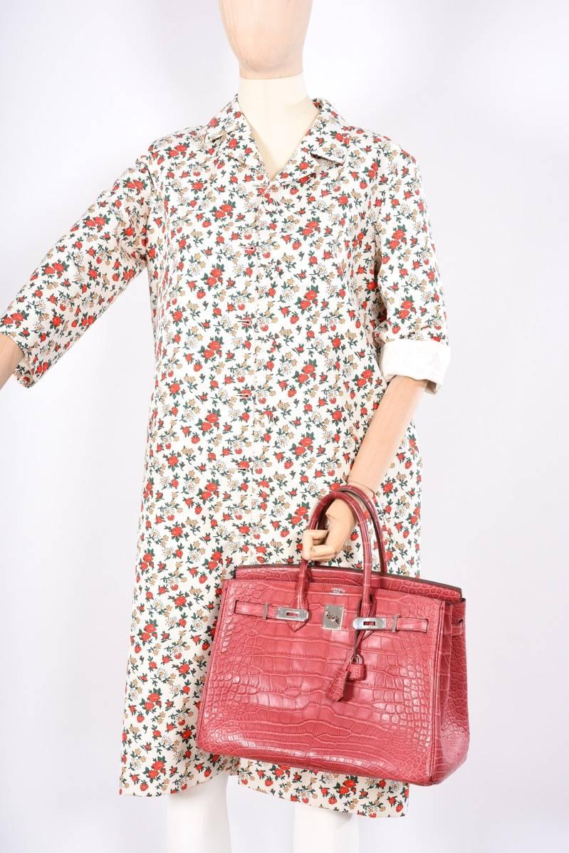 Hermes 35cm Boise de Rose alligator Birkin Bag with Palladium Hardware.

Hardware: Palladium
Country of Origin: France
Color: boise de rose 
Accompanied by: Dust Bag, Lock, Key, Raincoat, CITES, Box.
Primary Material: alligator  
Height (in