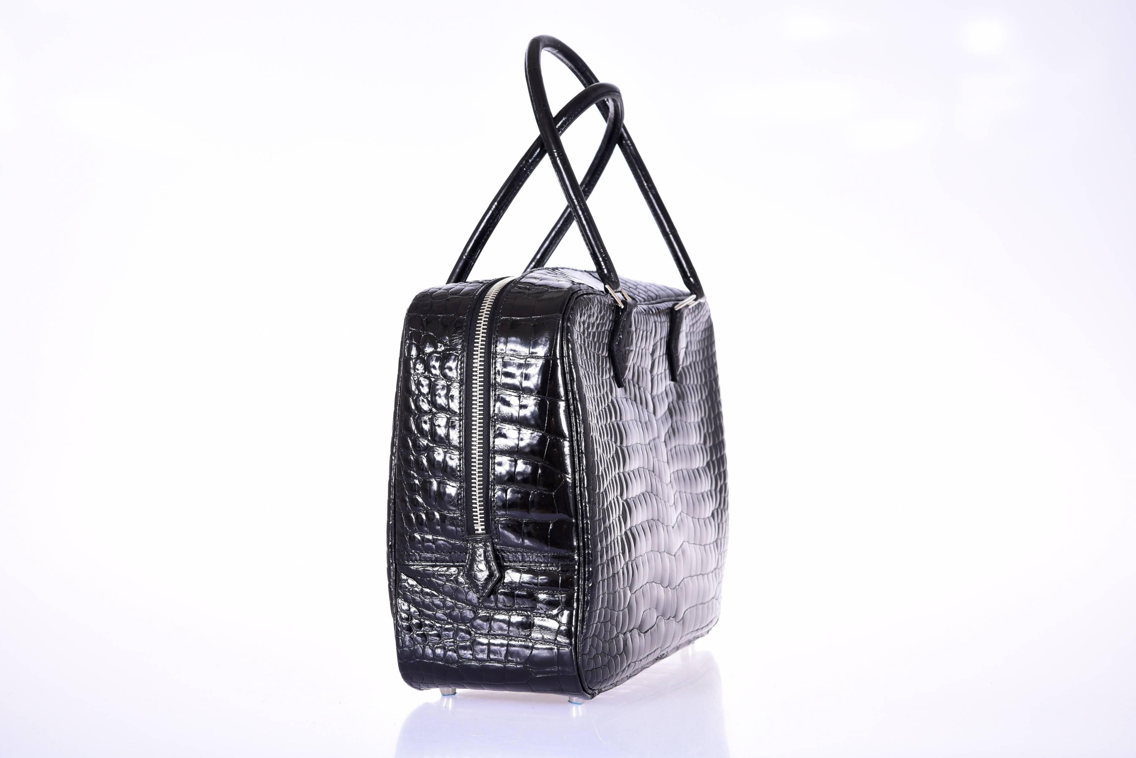 New Condition
HERMES Plume Porosus black crocodile PHW

As always, another one of my fab finds! Hermes very special porosus Plume perfect size for everyday 32cm! 

Includes: Hermes box, dust bag, booklet 
Origin: France
Production Year: