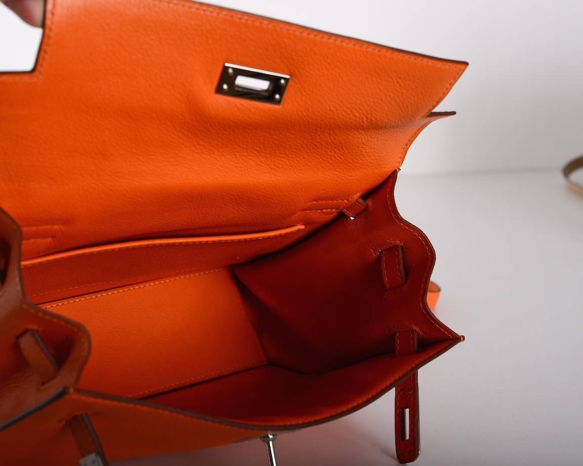 As always, another one of my fab finds! Hermes KELLY DANSE IN A STUNNING ORANGE. The leather is SWIFT with palladium hardware.
THIS KELLY IS VERY SPECIAL! NO LONGER AVAILABLE AT HERMES! 

This bag comes with a sleeper and a belt. Wear it as a