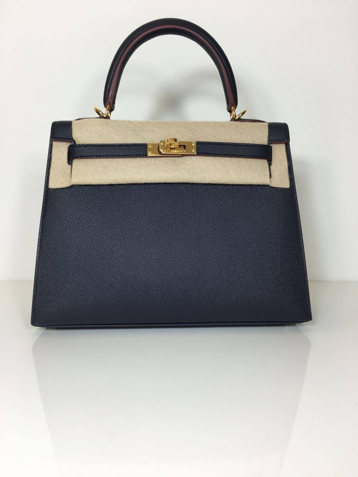 Hermes Limited edition
Kelly size 25 
Epsom leather 
Colour indigo blue/ red (wax, outlines) 
gold hardware 
store fresh, comes with receipt and full set (dust bag, box...) 
Hydeparkfashion specializes in sourcing and delivering authentic
