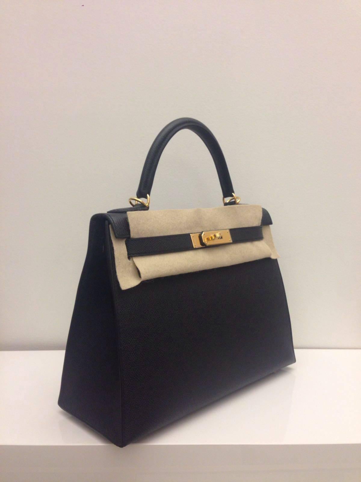 Hermes 
Kelly Size 28
Epsom leather 
Colour Noir (black)
Gold Hardware 
store fresh, comes with receipt and full set (dust bag, box...) 
Hydeparkfashion specializes in sourcing and delivering authentic luxury handbags, mainly Hermes, to client
