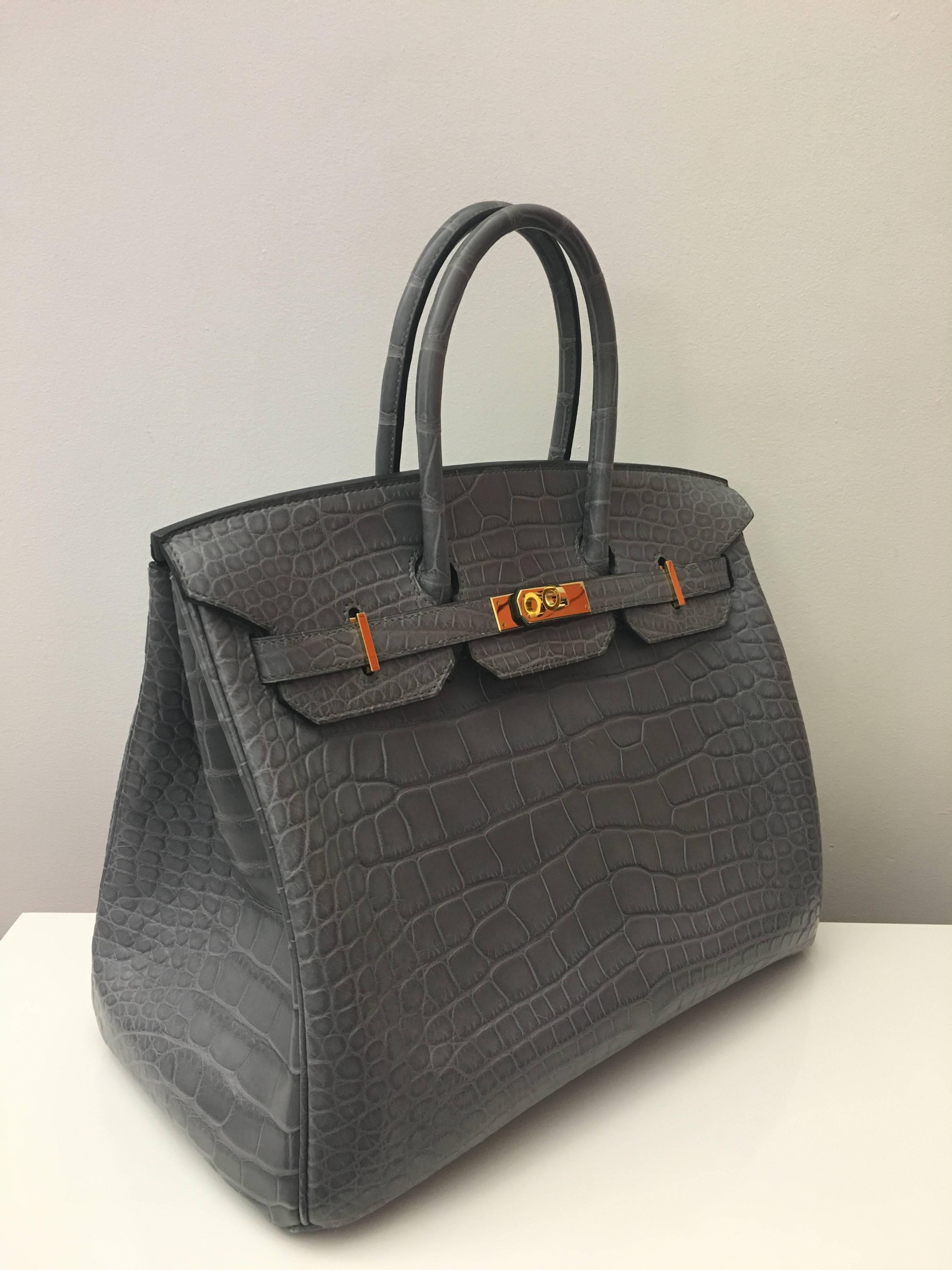 Hermes
Birkin size 35
Leather: Crocodile skin 
Color: Gris De Paris (extremely rare color)
gold hardware 
comes with receipt and full set (dust bag, box...) 
Hydeparkfashion specializes in sourcing and delivering authentic luxury handbags,