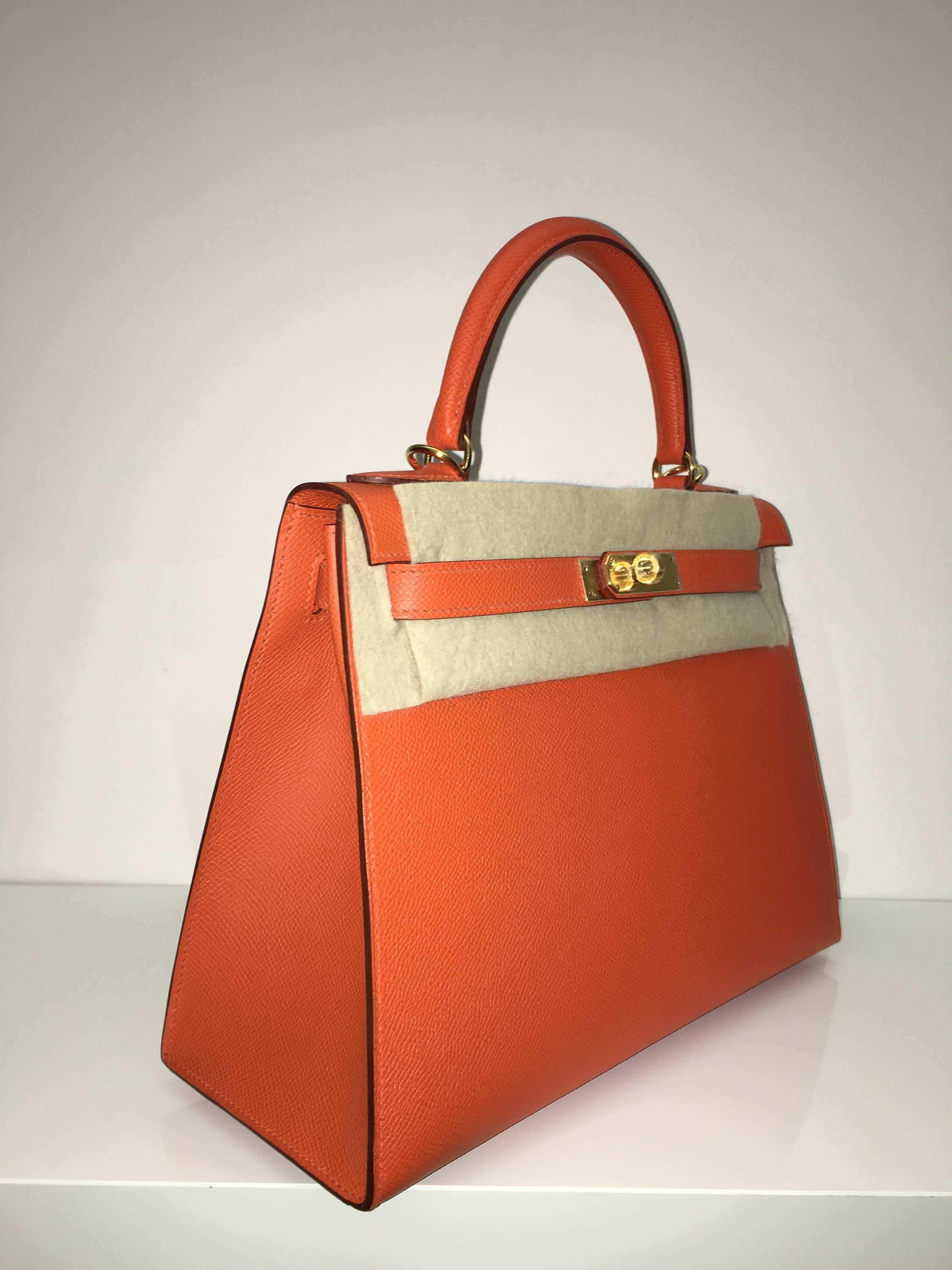 Hermes 
Kelly Size 28
Epsom Leather 
Colour Fue (Orange)
Gold Hardware 
store fresh, comes with receipt and full set (dust bag, box...) 
Hydeparkfashion specializes in sourcing and delivering authentic luxury handbags, mainly Hermes, to client