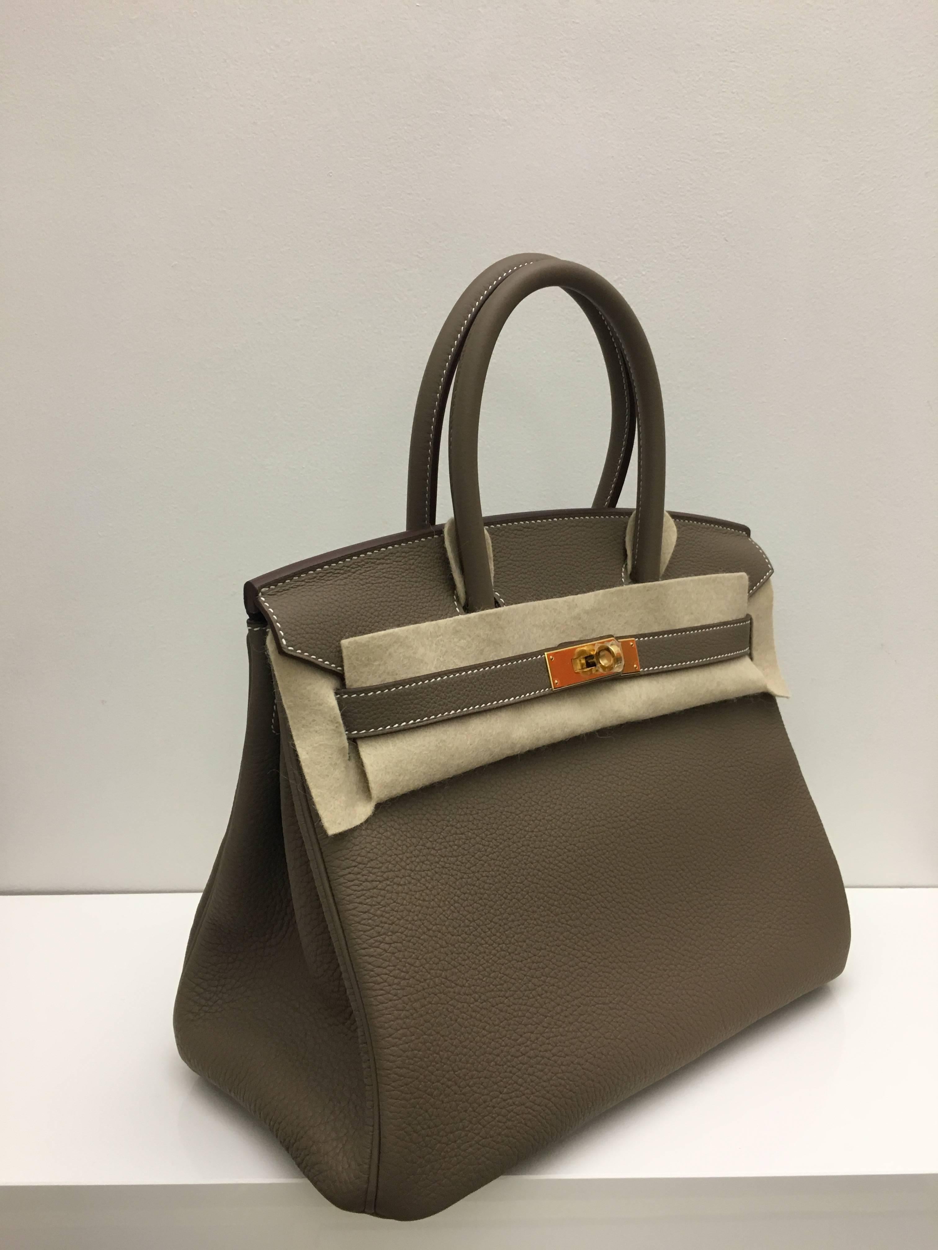 Hermes 
Birkin Size 30
Togo Leather 
Colour Etoupe
Gold Hardware 
store fresh, comes with receipt and full set (dust bag, box...) 
Hydeparkfashion specializes in sourcing and delivering authentic luxury handbags, mainly Hermes, to client