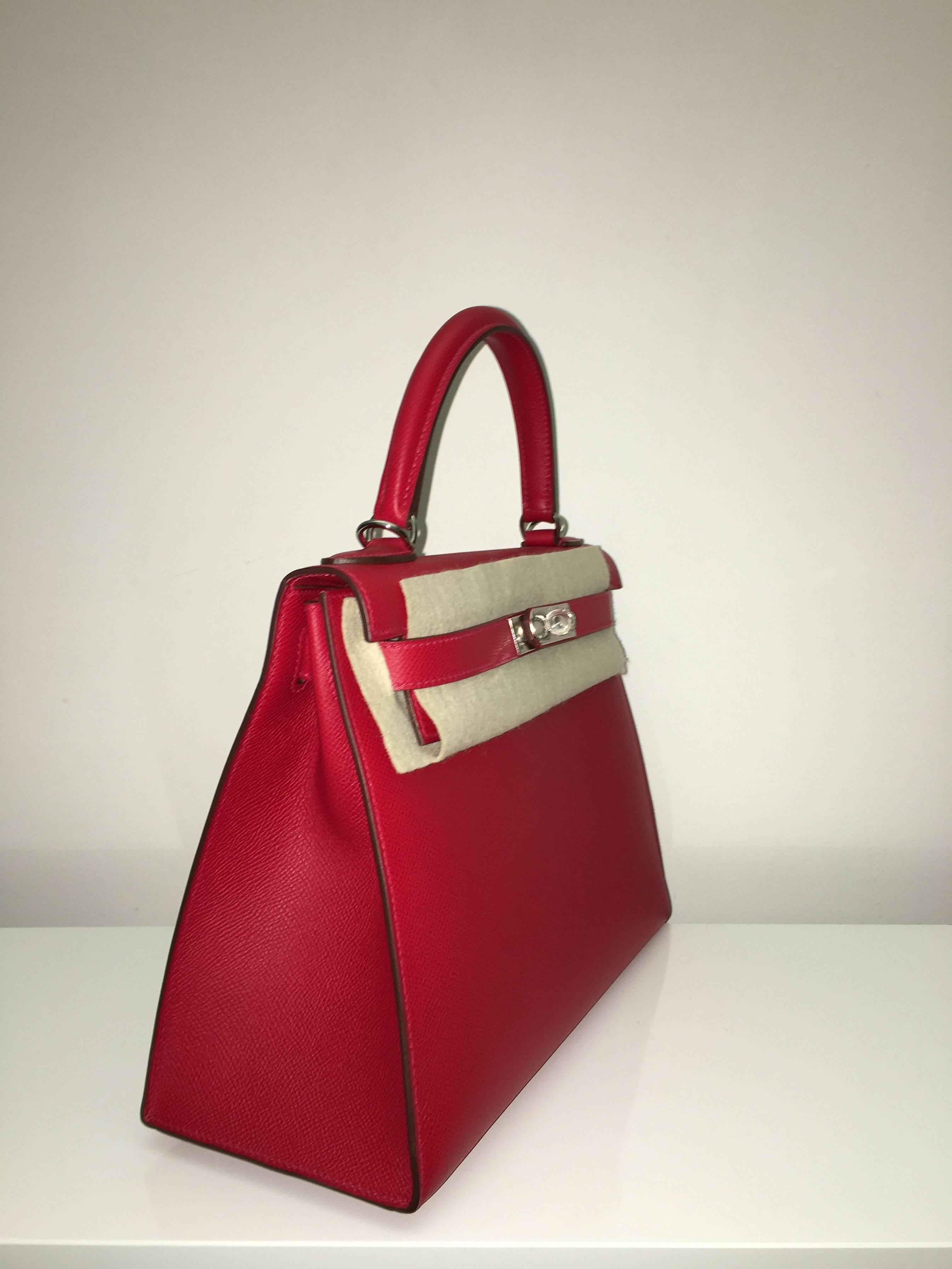 Hermes 
Kelly Size 28
Epsom Leather 
Colour Rouge Casak
Palladium (silver) Hardware 
store fresh, comes with receipt and full set (dust bag, box...) 
Hydeparkfashion specializes in sourcing and delivering authentic luxury handbags, mainly