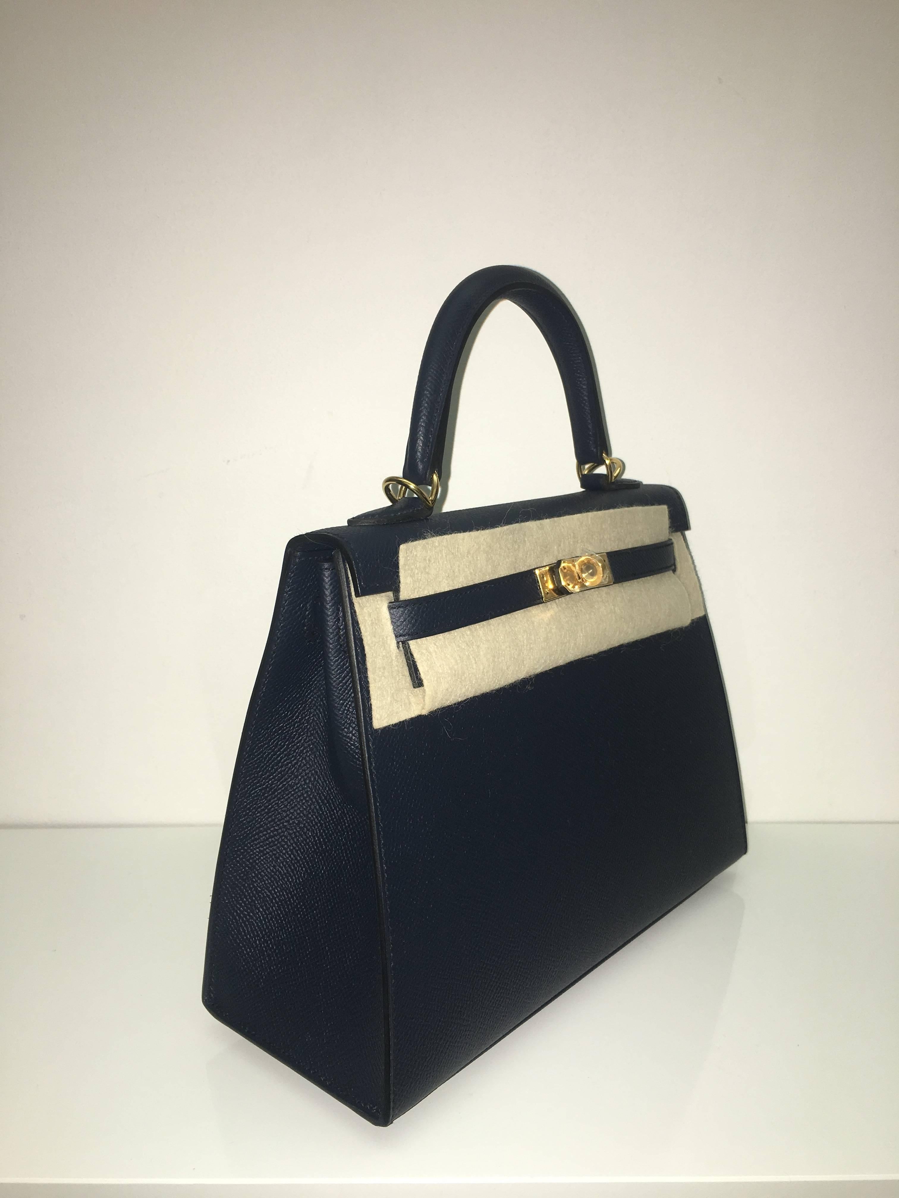 Hermes 
Kelly Size 25
Epsom Leather 
Colour Blue Indigo
Gold Hardware 
store fresh, comes with receipt and full set (dust bag, box...) 
Hydeparkfashion specializes in sourcing and delivering authentic luxury handbags, mainly Hermes, to client
