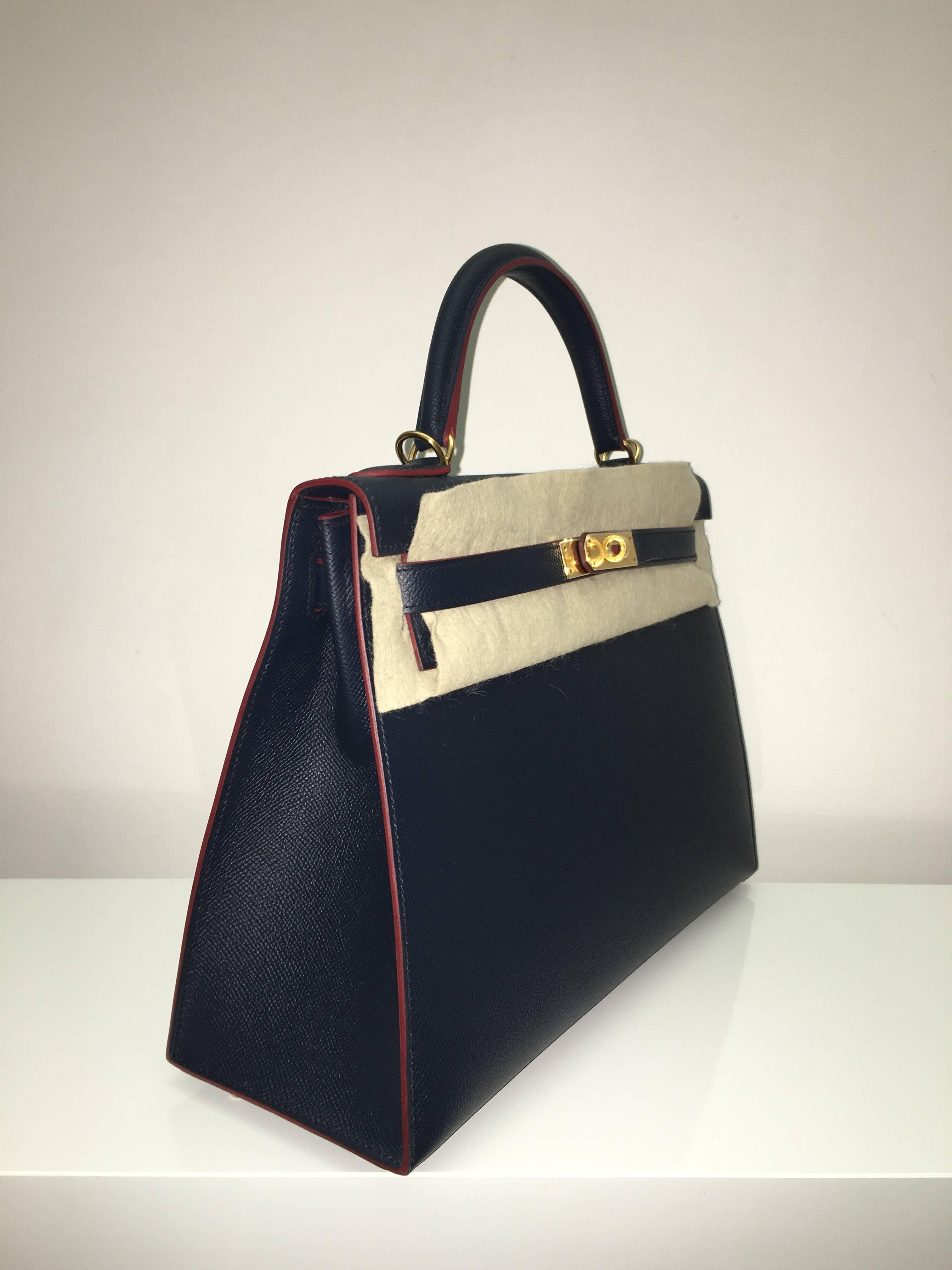 Hermes 
Kelly Size 32
Epsom Leather 
Colour Blue Indigo/Rouge H contour
Gold Hardware 
store fresh, comes with receipt and full set (dust bag, box...) 
Hydeparkfashion specializes in sourcing and delivering authentic luxury handbags, mainly