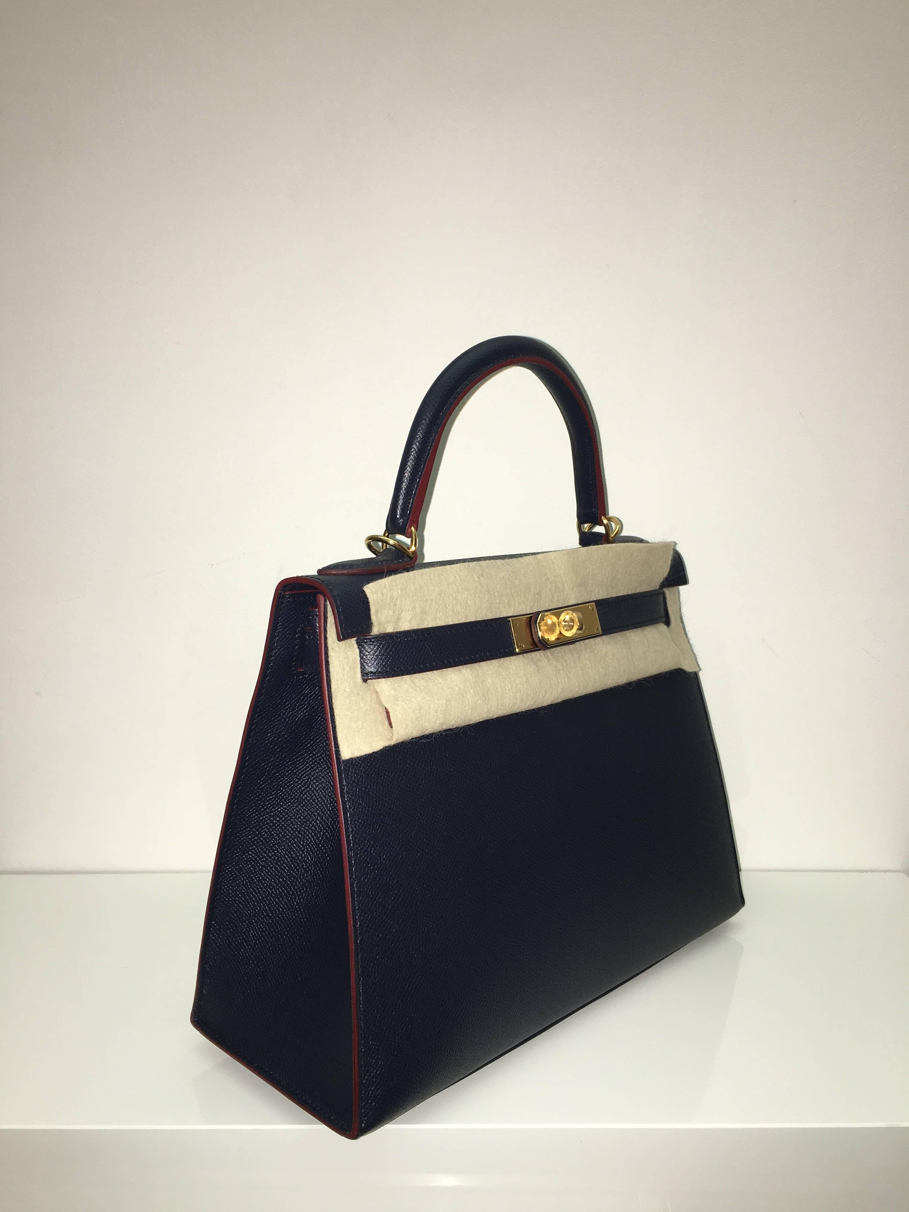Hermes 
Kelly Size 28
Epsom Leather 
Colour Blue Indigo/Rouge H contour
Gold Hardware 
store fresh, comes with receipt and full set (dust bag, box...) 
Hydeparkfashion specializes in sourcing and delivering authentic luxury handbags, mainly