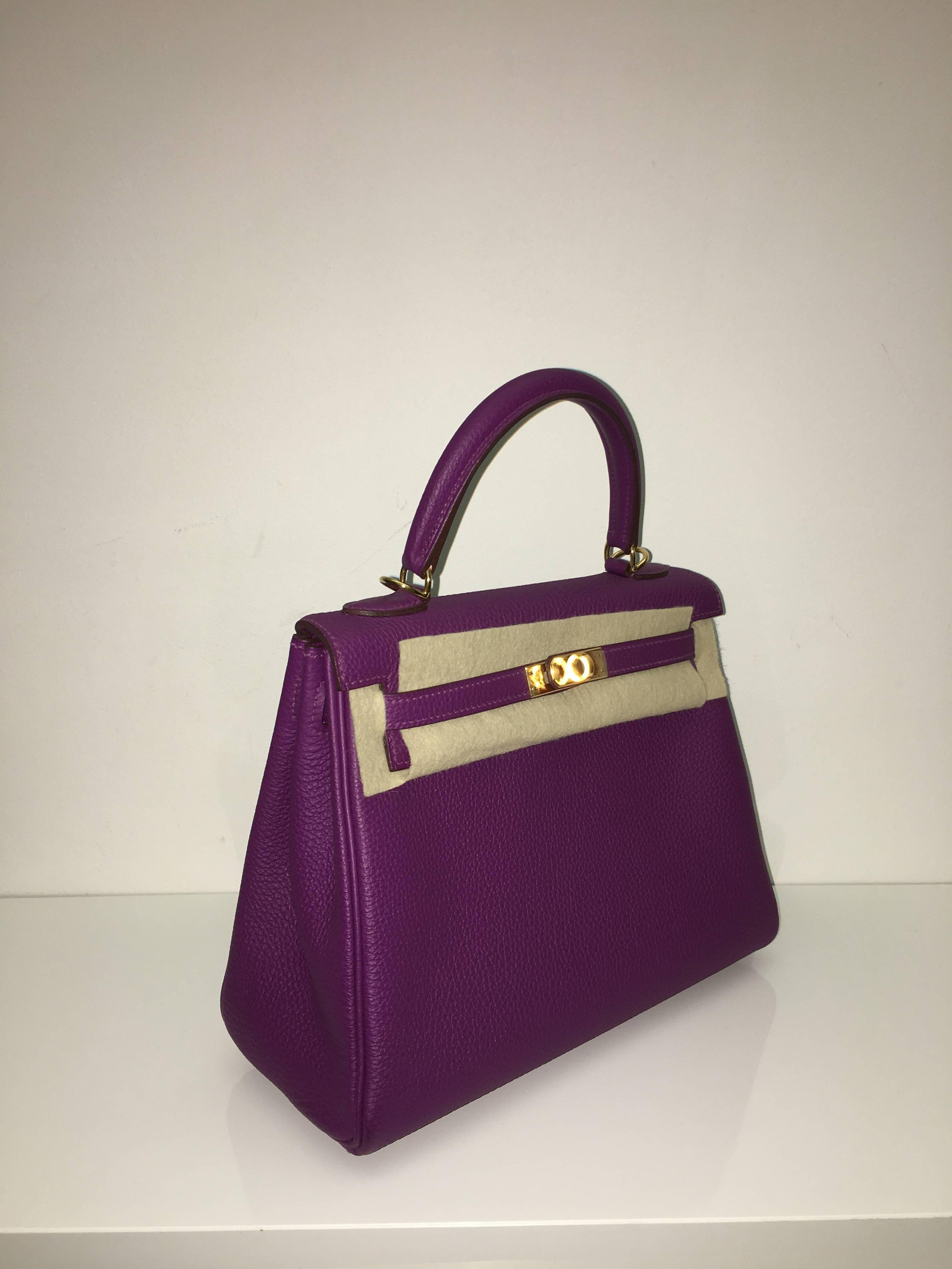 Hermes 
Kelly Size 25
Togo Leather 
Colour Anemone
Gold Hardware 
store fresh, comes with receipt and full set (dust bag, box...) 
Hydeparkfashion specializes in sourcing and delivering authentic luxury handbags, mainly Hermes, to client