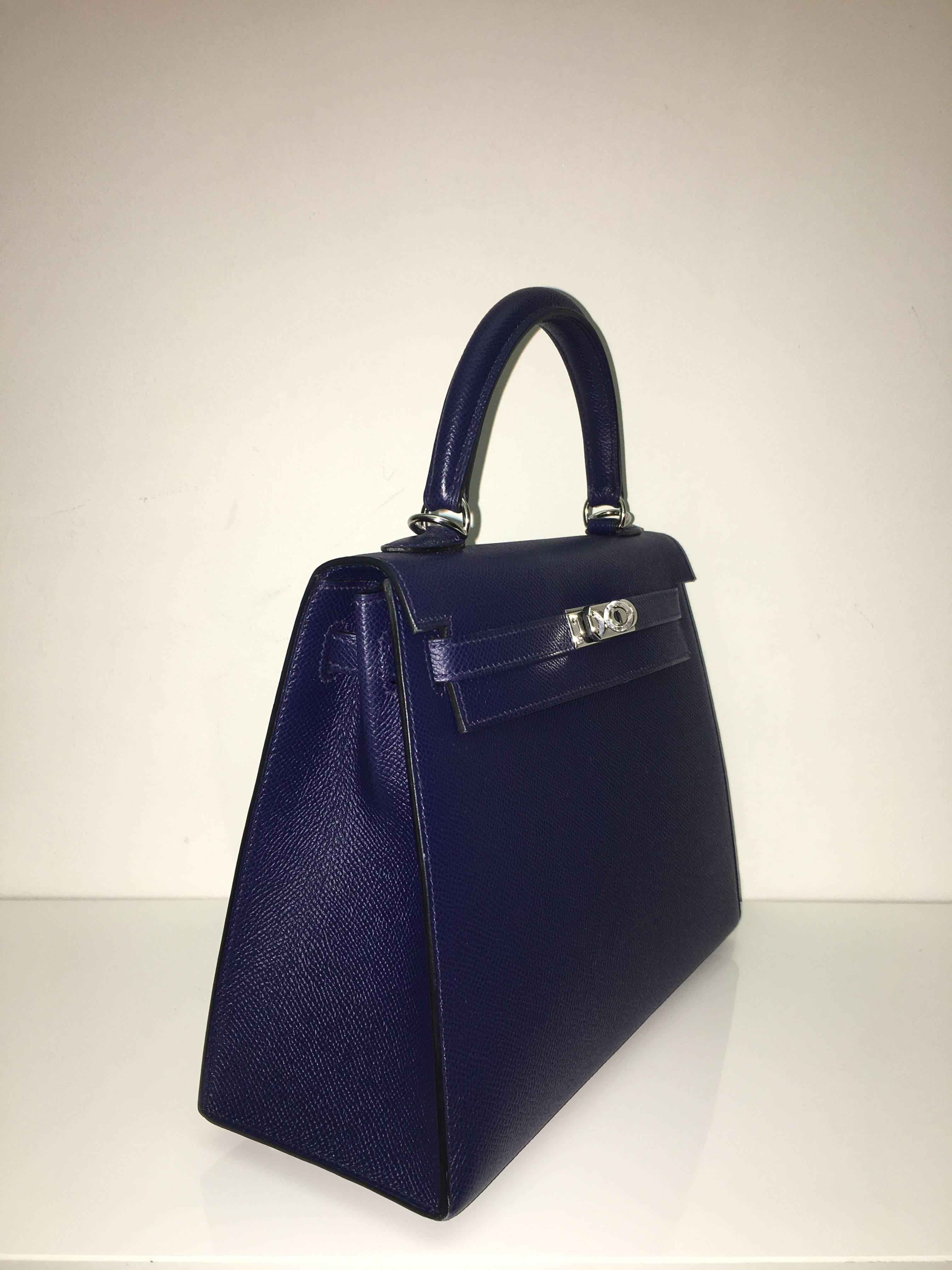 Hermes 
Kelly Size 25
Epsom Leather 
Colour Blue Sapphire
Silver (palladium) Hardware 
store fresh, comes with receipt and full set (dust bag, box...) 
Hydeparkfashion specializes in sourcing and delivering authentic luxury handbags, mainly