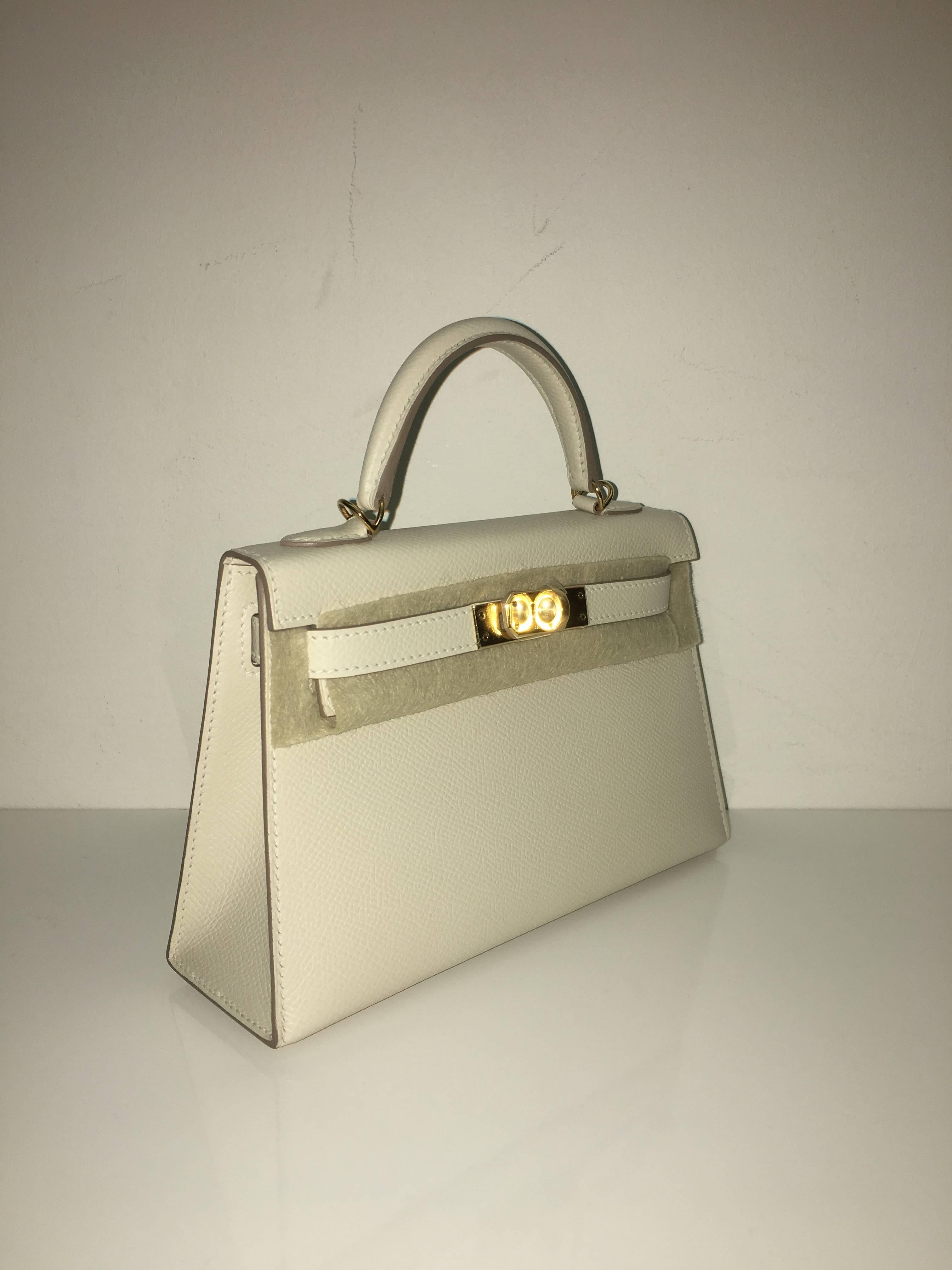 Hermes 
Kelly Size 20 (mini)
Epsom Leather 
Colour Craie
Gold Hardware 
store fresh, comes with receipt and full set (dust bag, box...) 
Hydeparkfashion specializes in sourcing and delivering authentic luxury handbags, mainly Hermes, to client