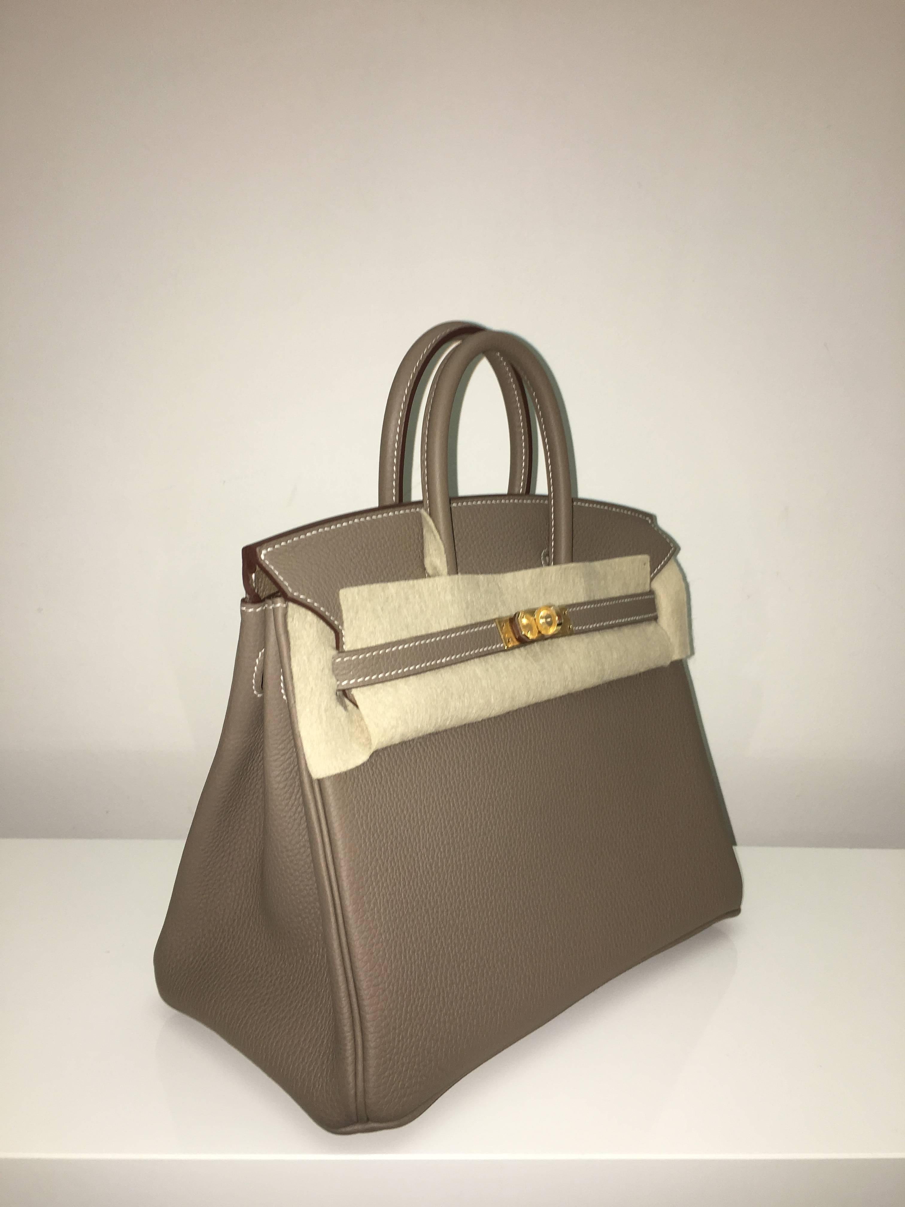 Hermes 
Birkin Size 25
Togo Leather 
Colour Etoupe
Gold Hardware 
store fresh, comes with receipt and full set (dust bag, box...) 
Hydeparkfashion specializes in sourcing and delivering authentic luxury handbags, mainly Hermes, to client