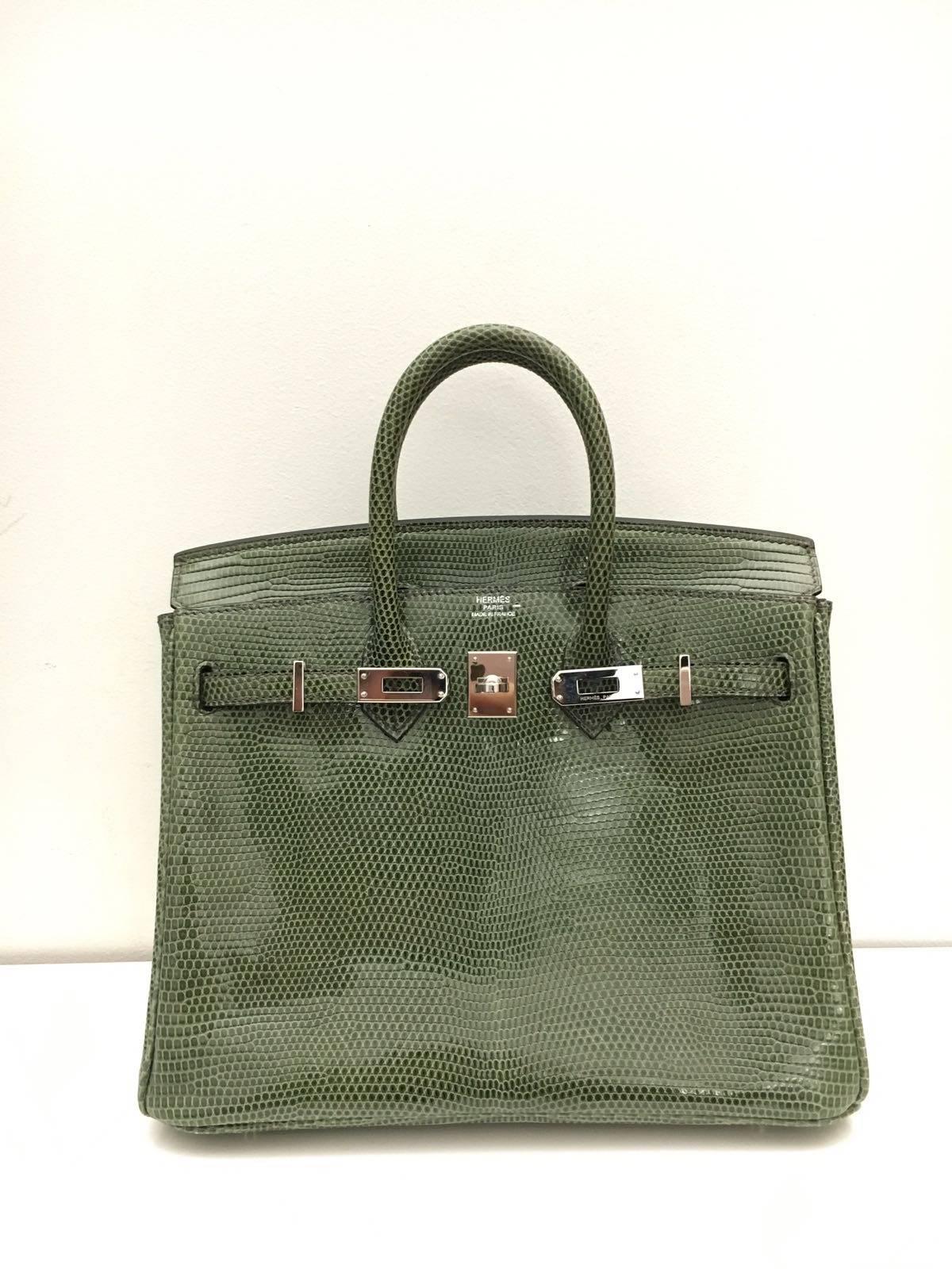 Hermes 
Birkin Size 25
Lizard Leather 
Colour Verte Olive 
Silver Hardware
Store fresh, comes with receipt and full set (dust bag, box...) 
Hydeparkfashion specializes in sourcing and delivering authentic luxury handbags, mainly Hermes, to clients