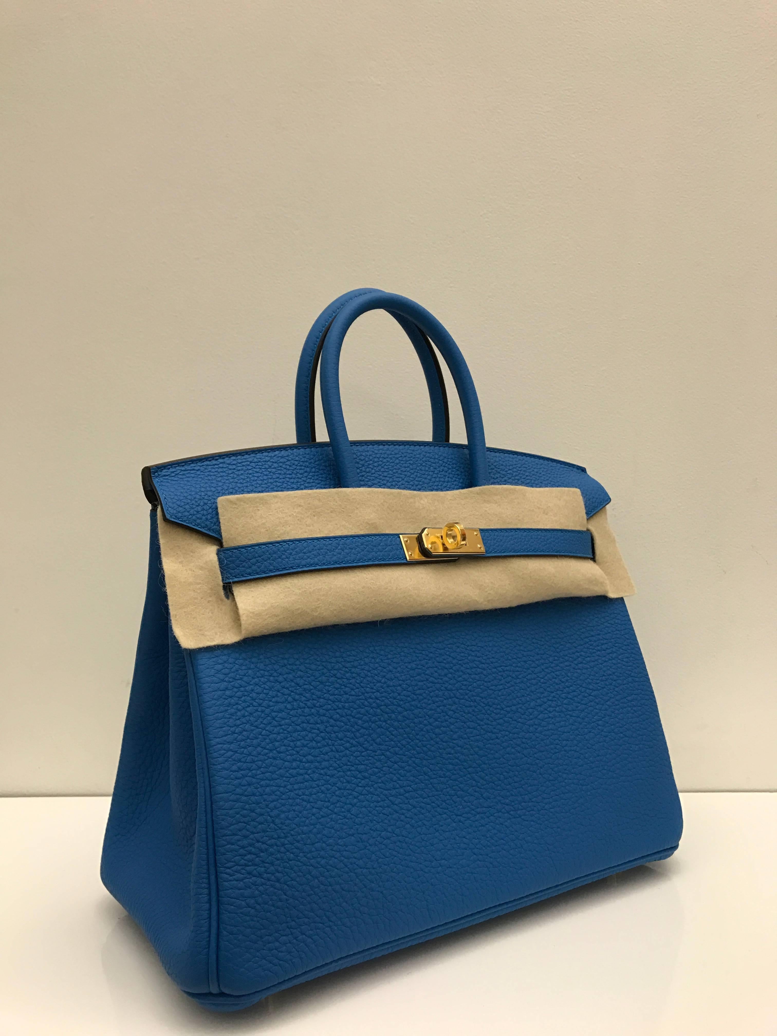 Hermes 
Birkin Size 25
Togo Leather 
Blue Zanzibar Colour
Gold Hardware
Store fresh, comes with receipt and full set (dust bag, box...) 
Hydeparkfashion specializes in sourcing and delivering authentic luxury handbags, mainly Hermes, to clients