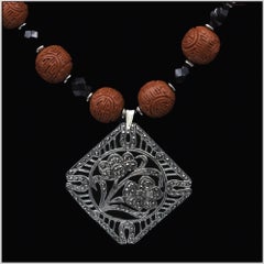 Vintage cinnabar pendant , cinnabar beads, and sterling comprise this unique pie