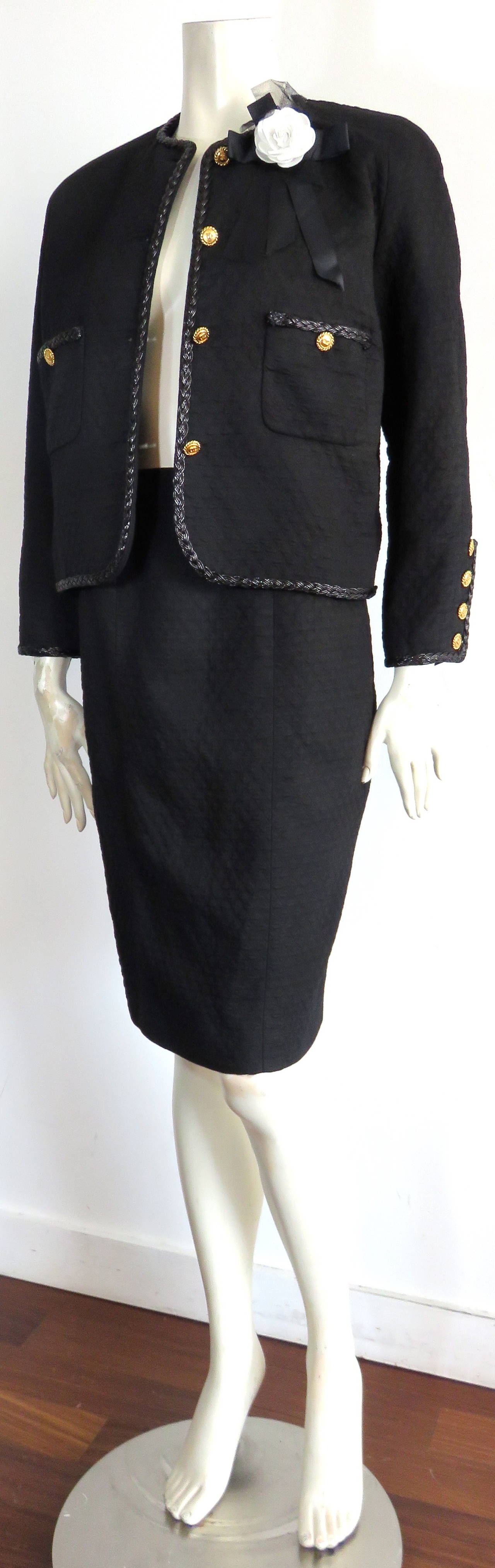 Great condition, 1980's CHANEL PARIS, classic, diamond quilted skirt suit.

This classic 2pc. skirt suit set is made of thick, black, diamond quilted cotton fabric with a compact hand-feel.

Classic, Chanel, boxy-silhouette jacket with