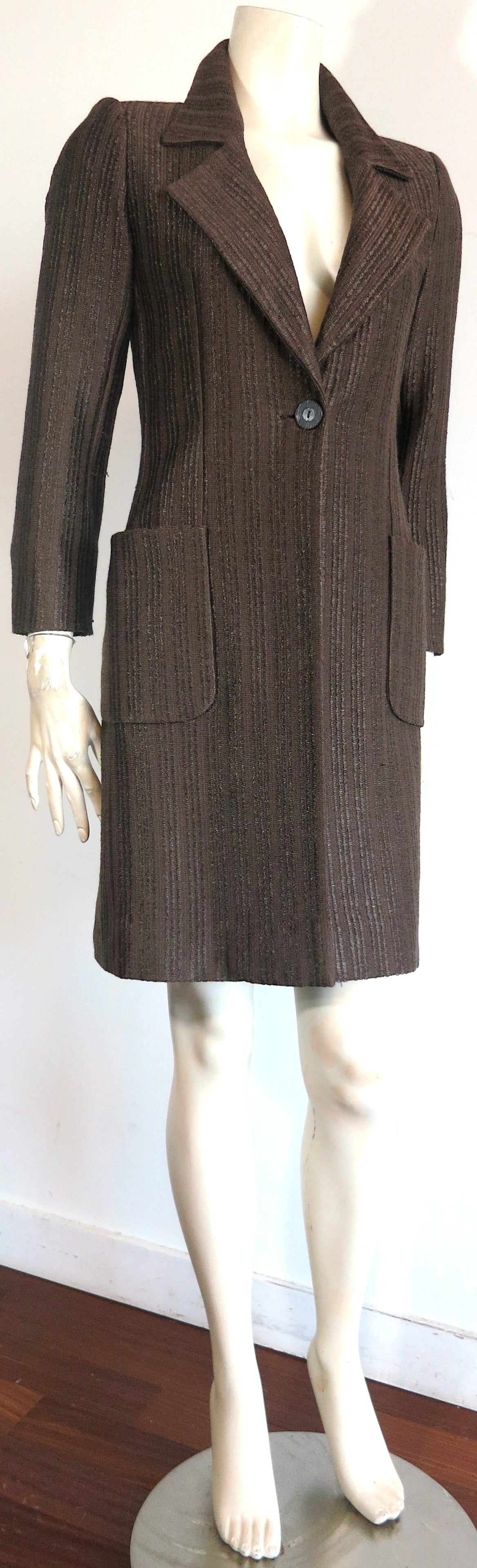 Excellent condition, 1990's YVES SAINT LAURENT Rive Gauche Raffia-weave coat in rick, dark brown color.

This amazing, textural coat is made of a cotton/viscose, raffia-style woven fabrication with a natural, slick surface reminiscent of basketry