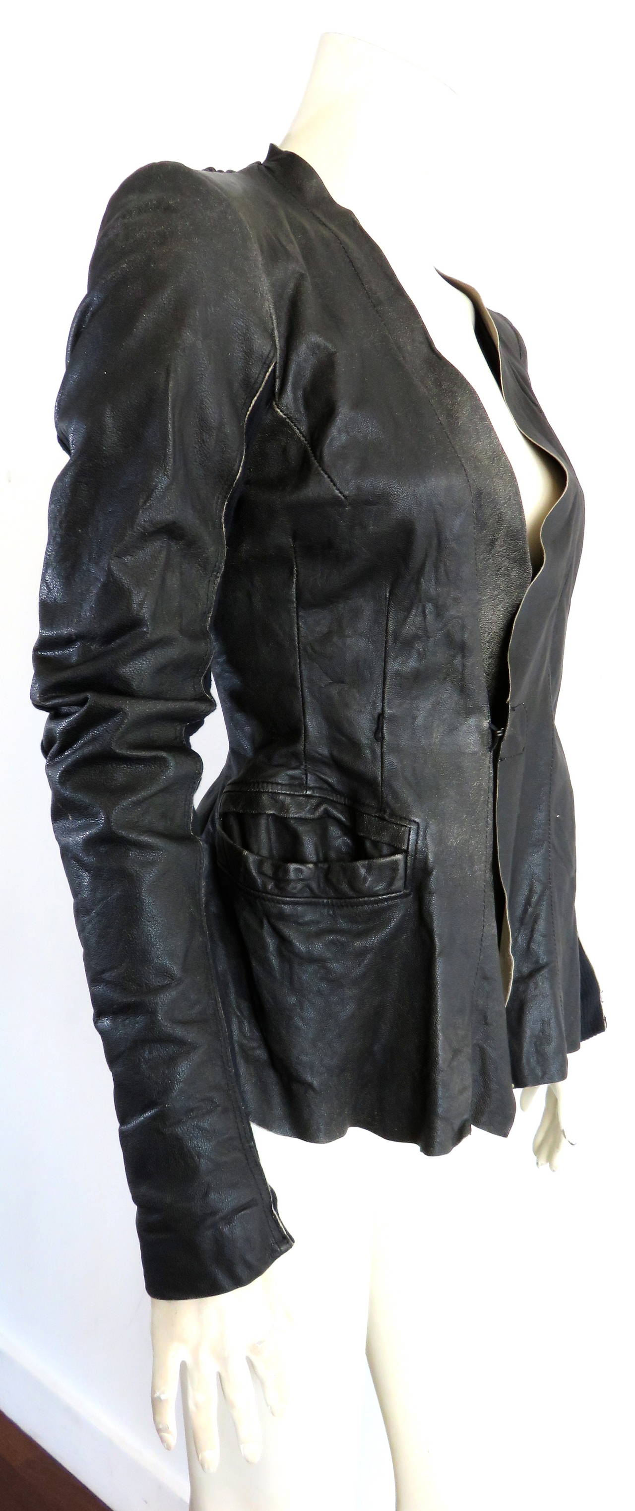 Early 2000's RICK OWENS, iconic, leather, and rib-knit jacket

Wonderfully aged, black/brown leather skin with pale beige underside of leather

Wool & silk blend, rib-knit panels at the under sleeves with silky beige sleeve lining, generously