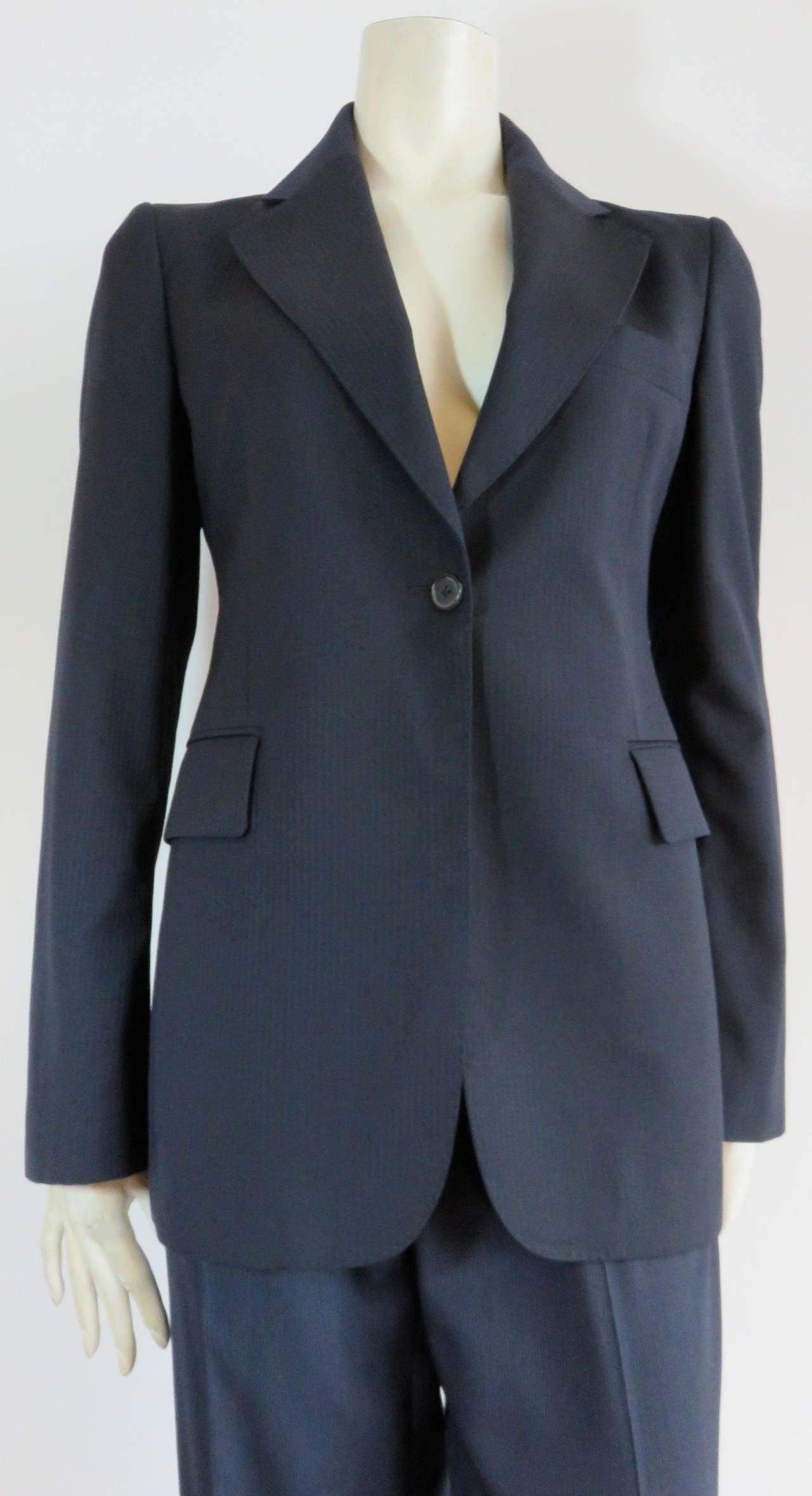 Worn only once, MAISON MARTIN MARGIELA, Replica series, midnight-blue tailored jacket & pant set for women

This great Margiela suit set is comprised of a shadow stripe jacket that is a modern replica of a 1970's, boy's tailored jacket, from