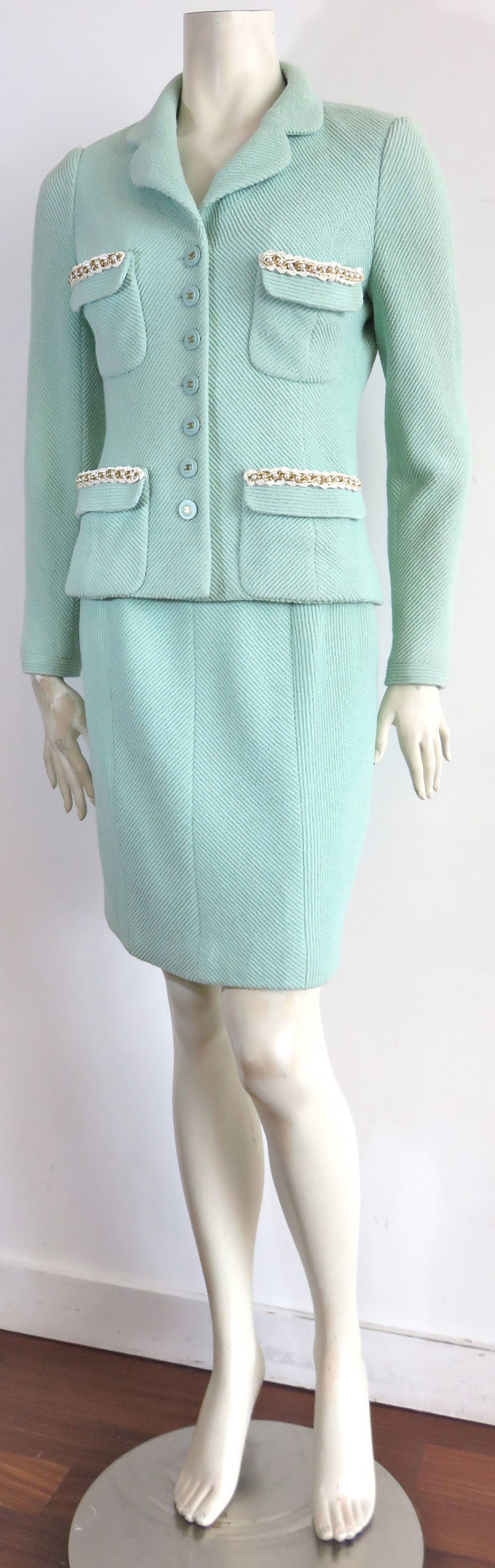 Excellent condition, 1990's CHANEL PARIS pale, mint ice green 2pc. skirt suit.

Made of a lovely, plush, wool boucle twill weave, this great set features gold finished, metal chain & pearl detail with crochet edging at the top edges of the