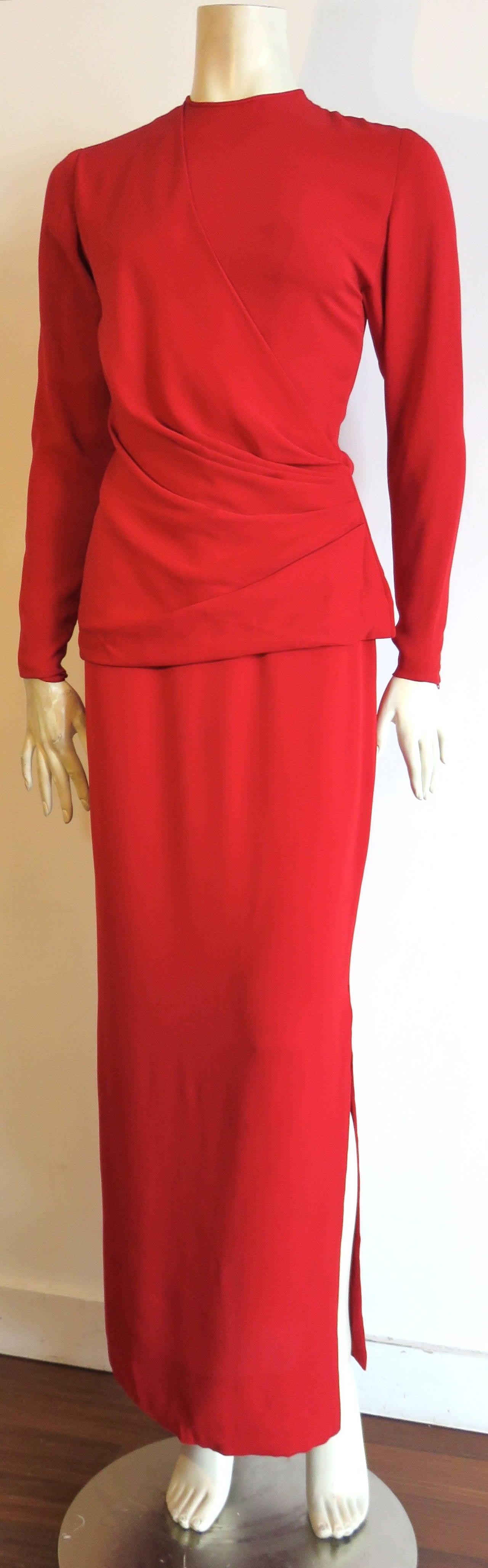 Gorgeous, 1980's GALANOS Red silk crepe 2pc. skirt and tunic top set.

This fabulous set features a long sleeve, draped tunic top with a 'wrap look' style front construction.  The pleated details at the wearer's lower left side seam are stitched