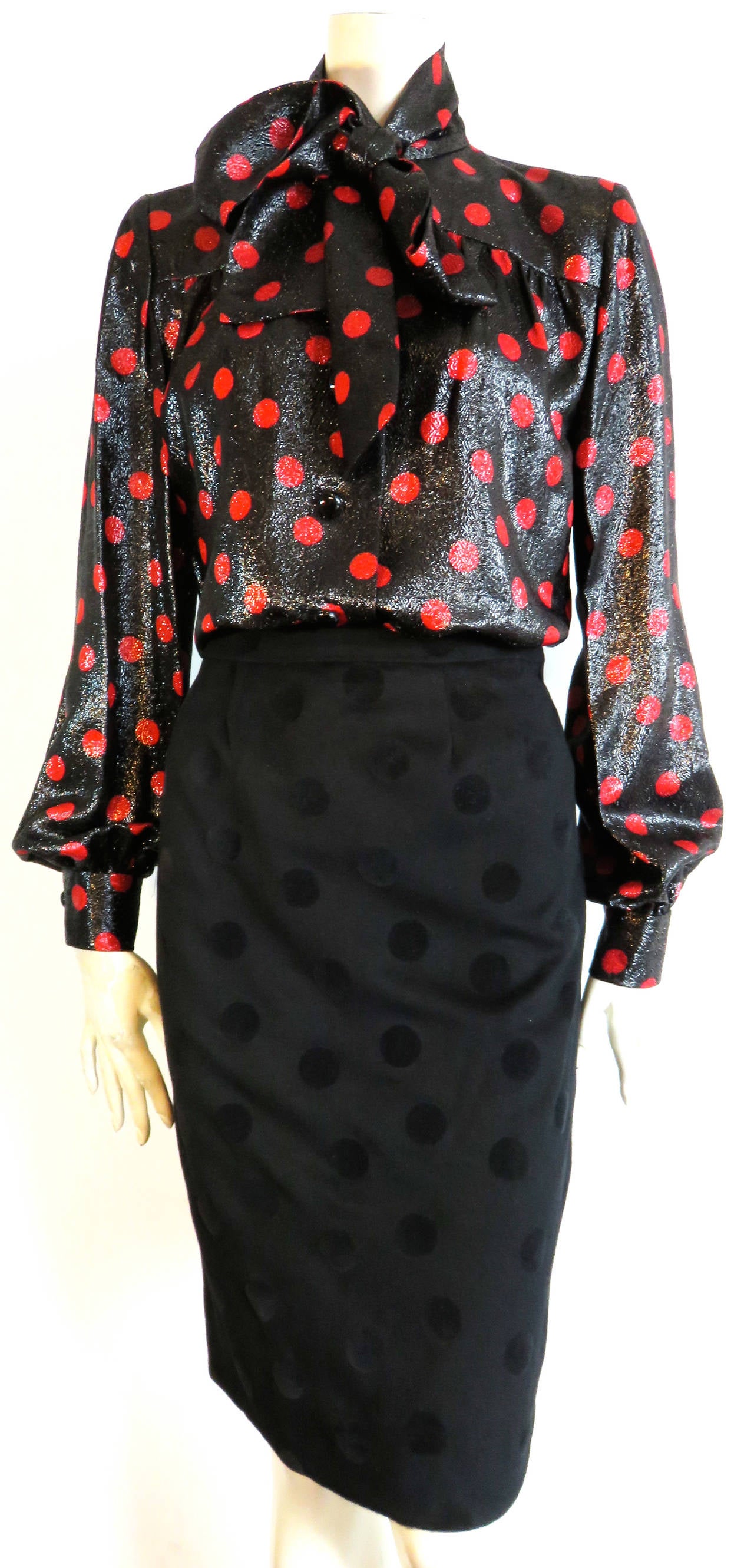 Excellent condition, 1970's GIVENCHY 3pc. Polka dot skirt suit & blouse set.

The black jacket and skirt are made of black wool with polka dotted, velvet flocking at the outer face of the fabric.  The jacket edges are bound in solid black velvet,